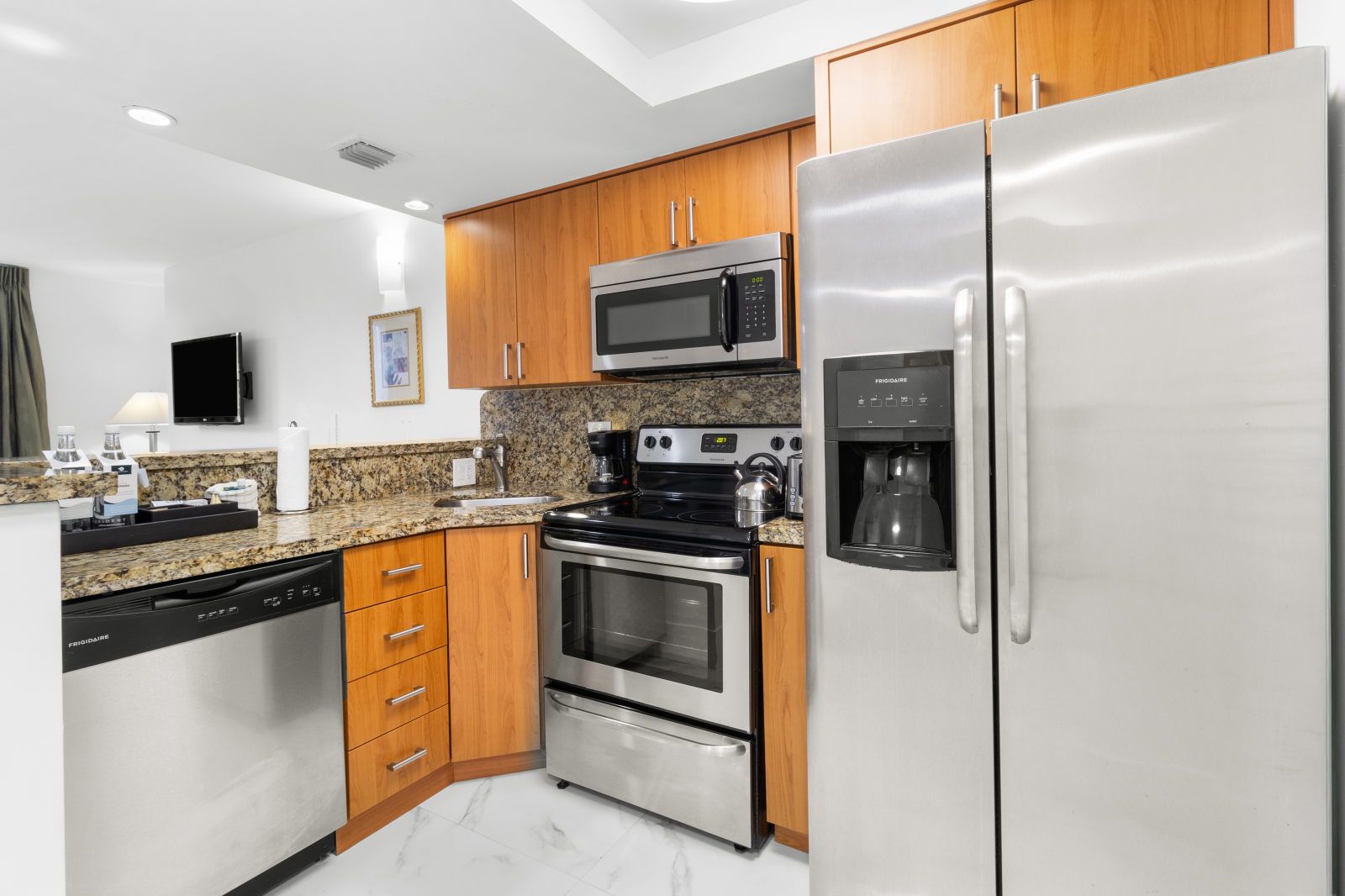 image Enjoy a well-organized kitchen space, complete with stainless steel appliances and a spacious countertop.