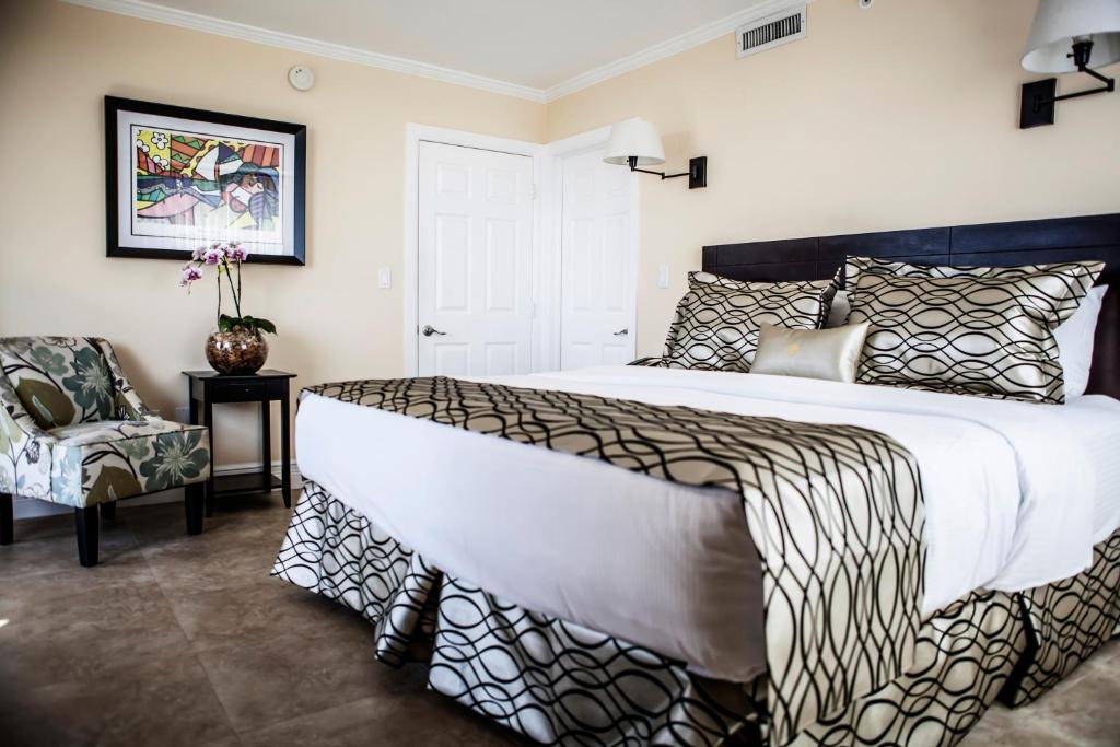 image Rest in luxurious comfort with a plush king bed, elegant décor, and cozy seating just steps away.