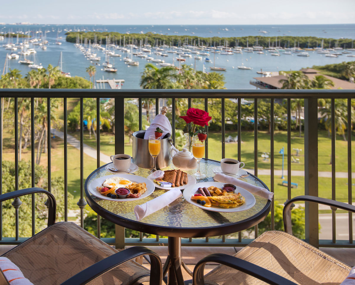 image Savor a delightful breakfast on the balcony, complete with stunning marina views.