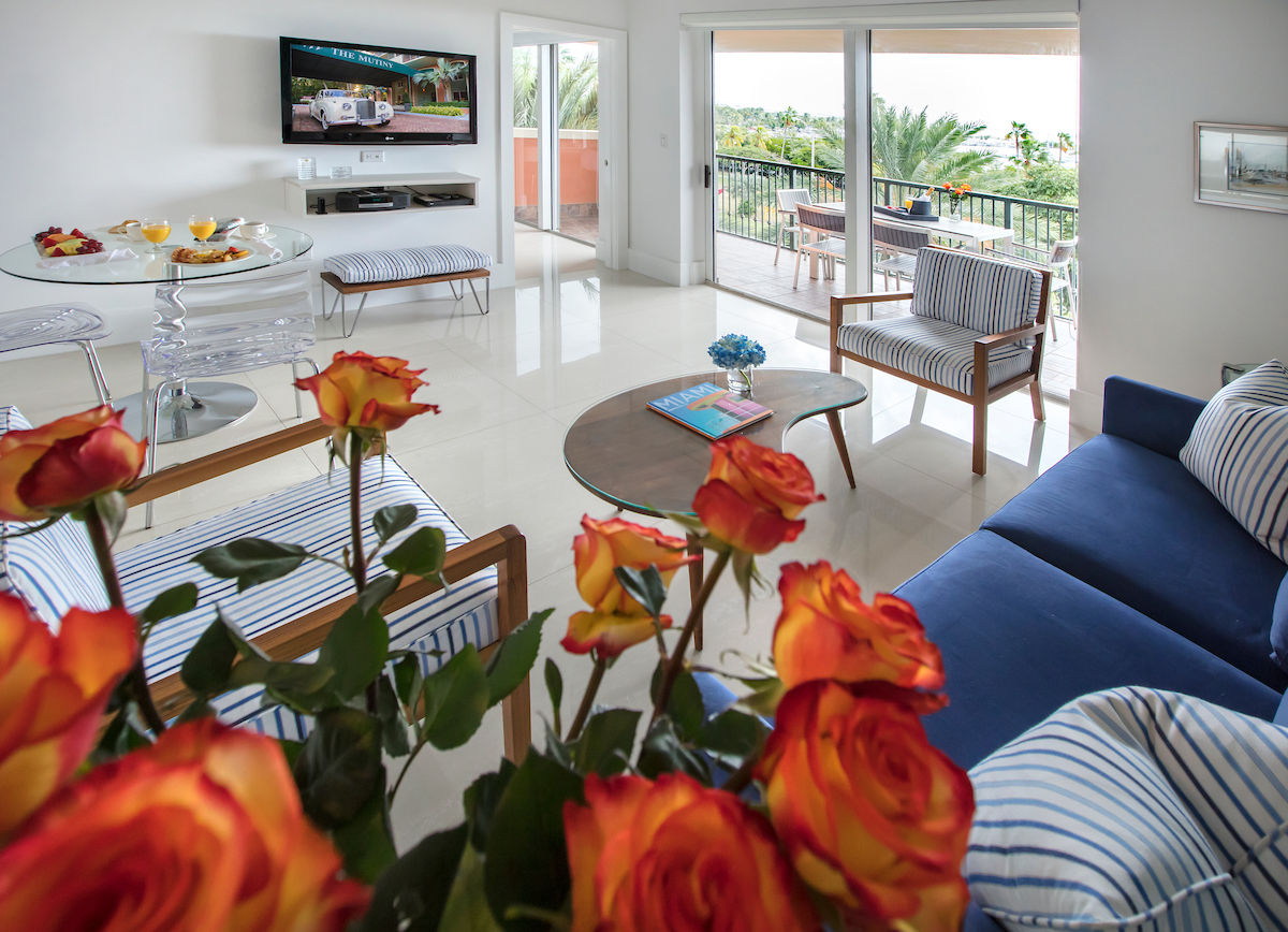 image Unwind in a stylish living area adorned with fresh flowers and inviting seating options.