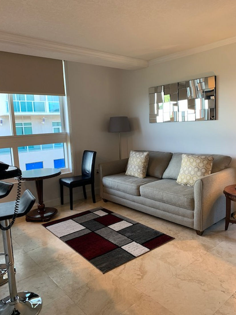 image Relax in a cozy living room with a plush sofa, perfect for winding down after a day of exploring.