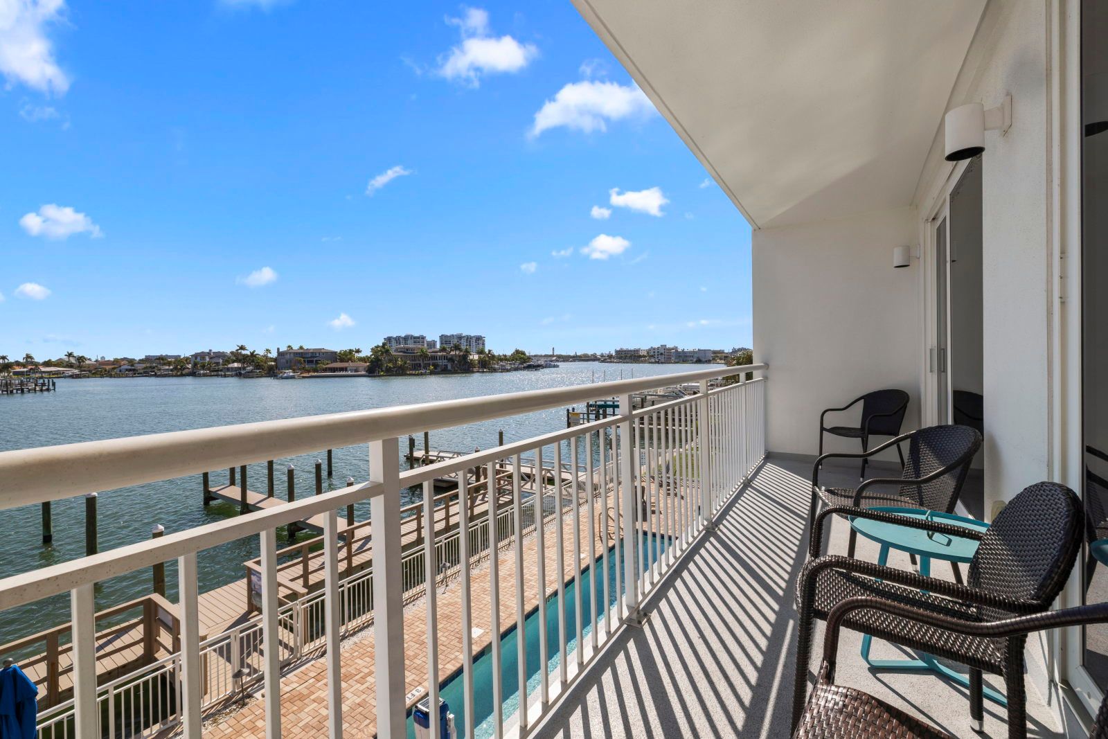 image Enjoy relaxing moments on your private balcony overlooking serene waters and a picturesque marina.