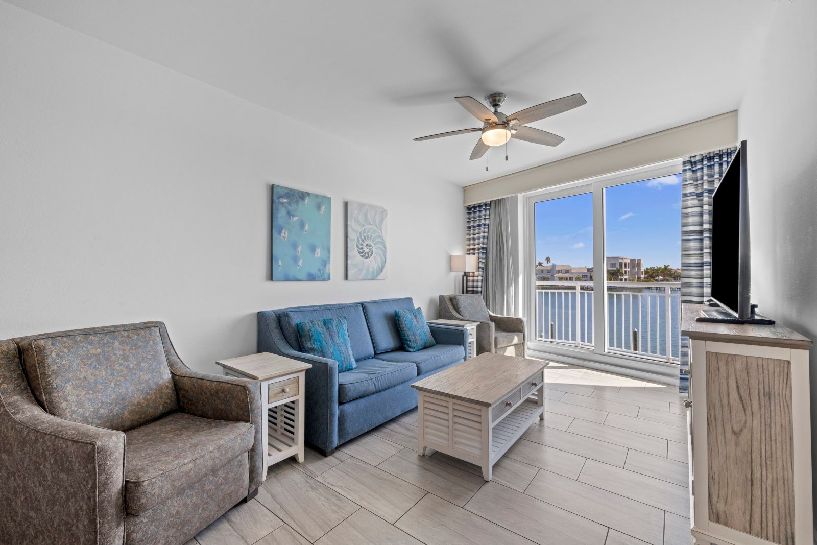 image Relax in this cozy living area, with comfortable seating and a view that invites tranquility.