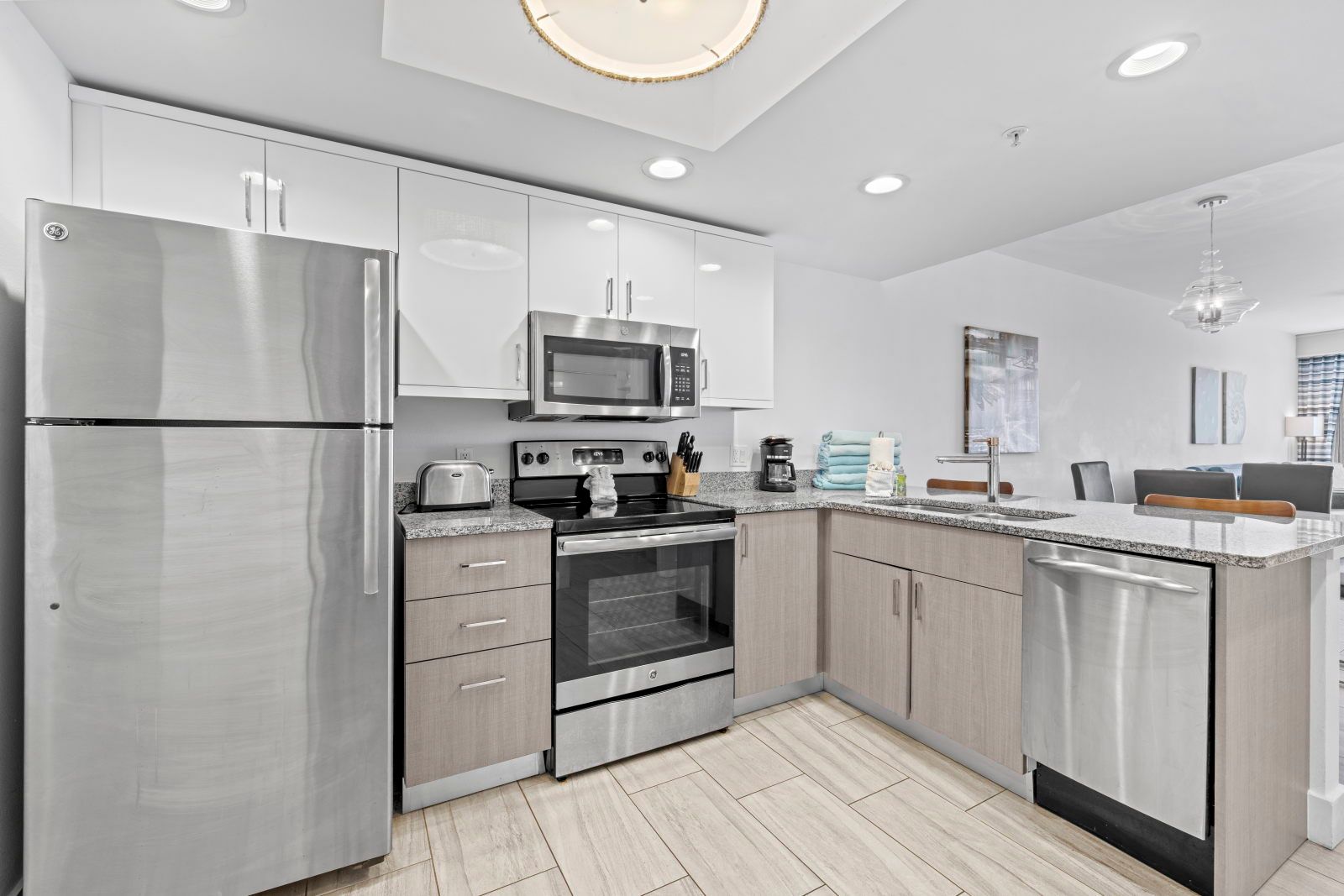 image An inviting kitchen space awaits, complete with polished surfaces and ample storage.