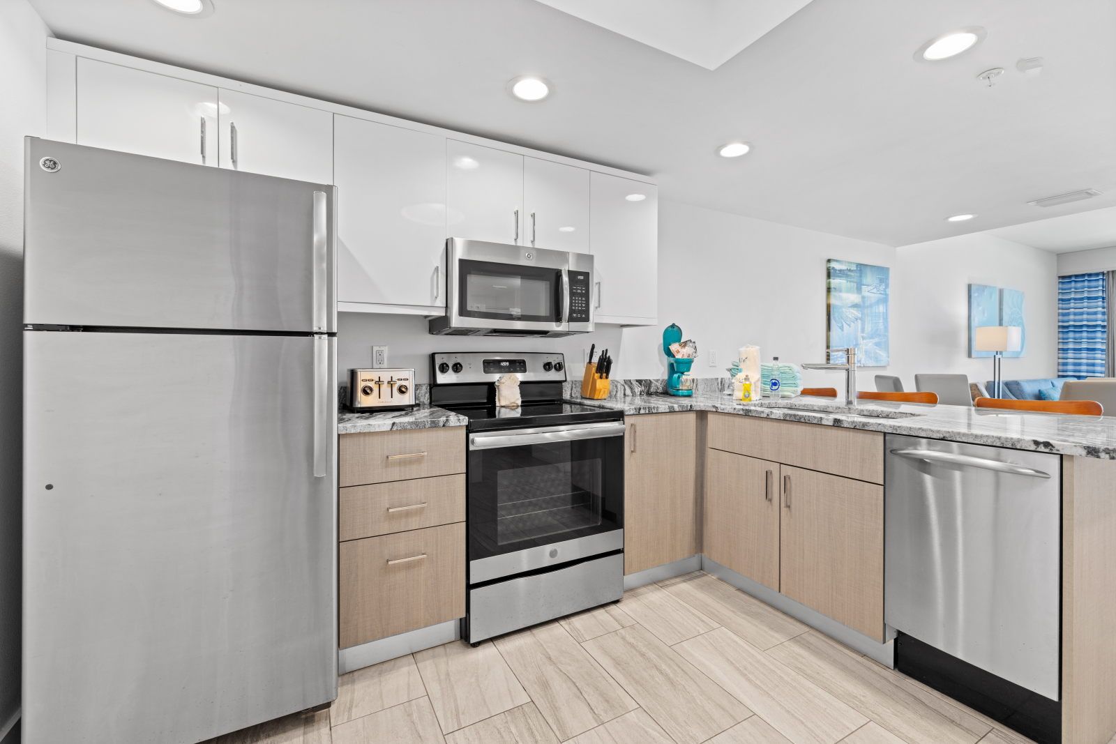 image Experience modern living with updated kitchen appliances and lovely finishes that invite creativity and comfort.