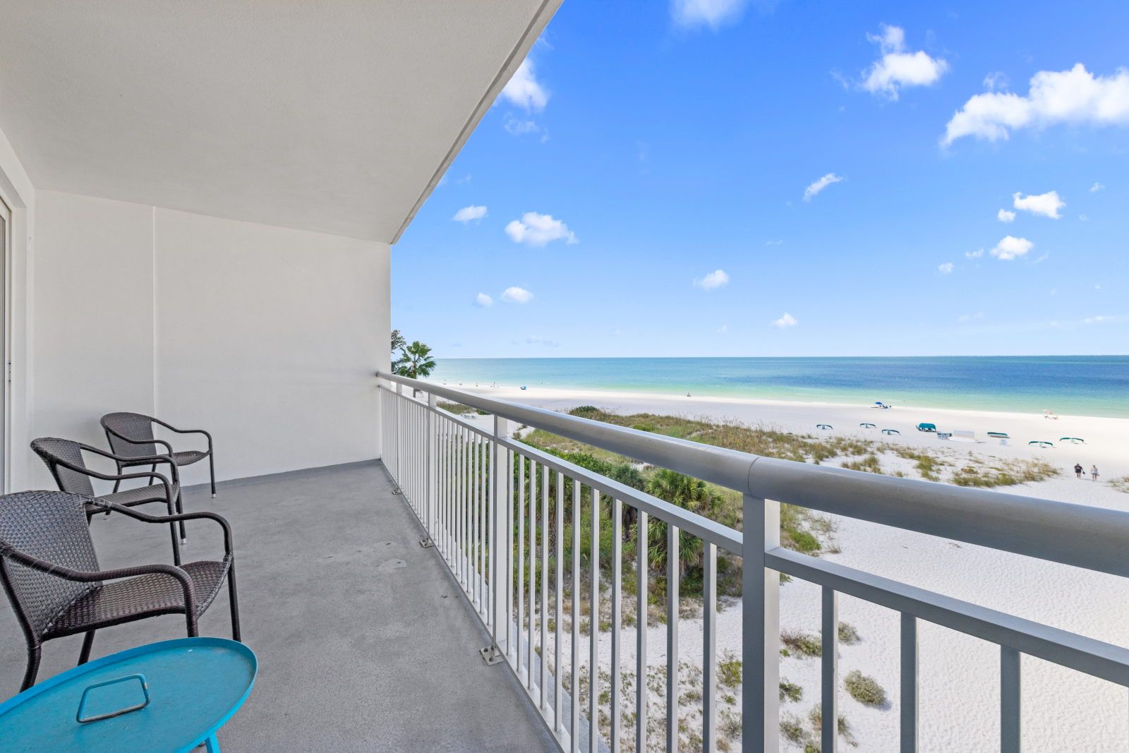 image Unwind on the balcony and soak in the calming sea breeze while enjoying the vibrant beachfront atmosphere.