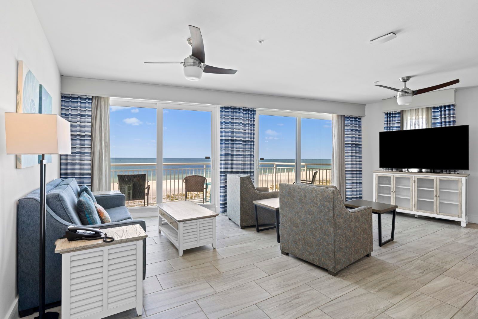 image Step into your serene living space, where comfort meets stunning Gulf views through spacious windows.