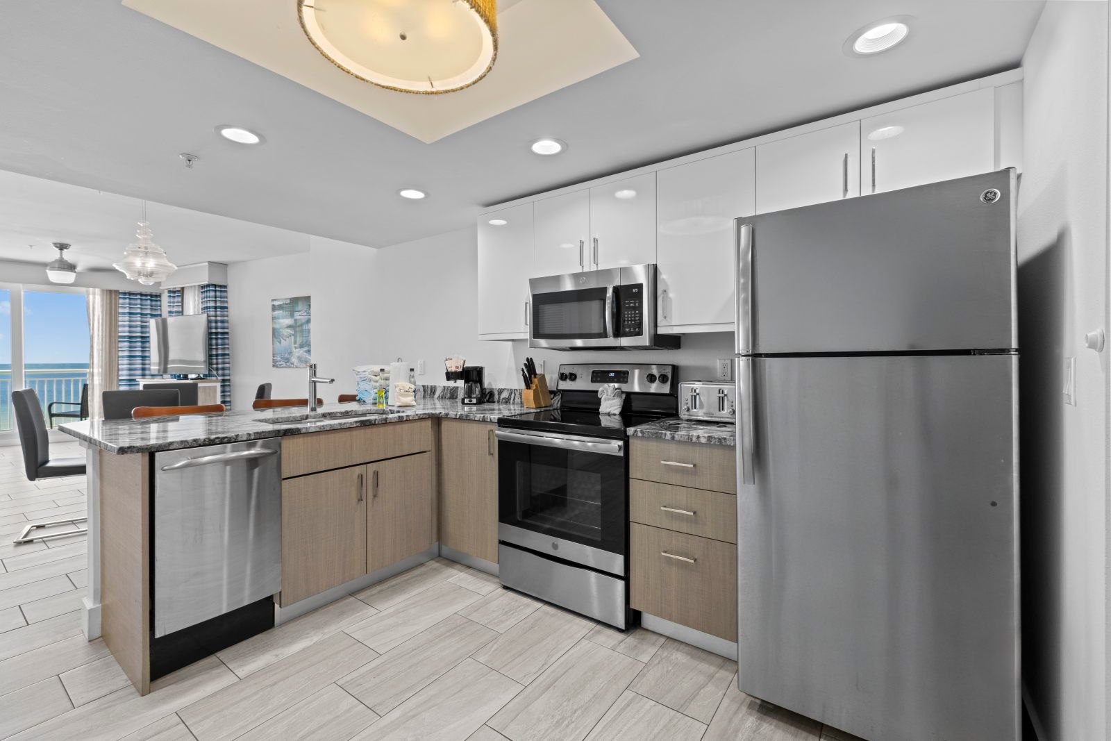 image Cook your favorite meals in this modern kitchen featuring stainless steel appliances and sleek granite countertops.