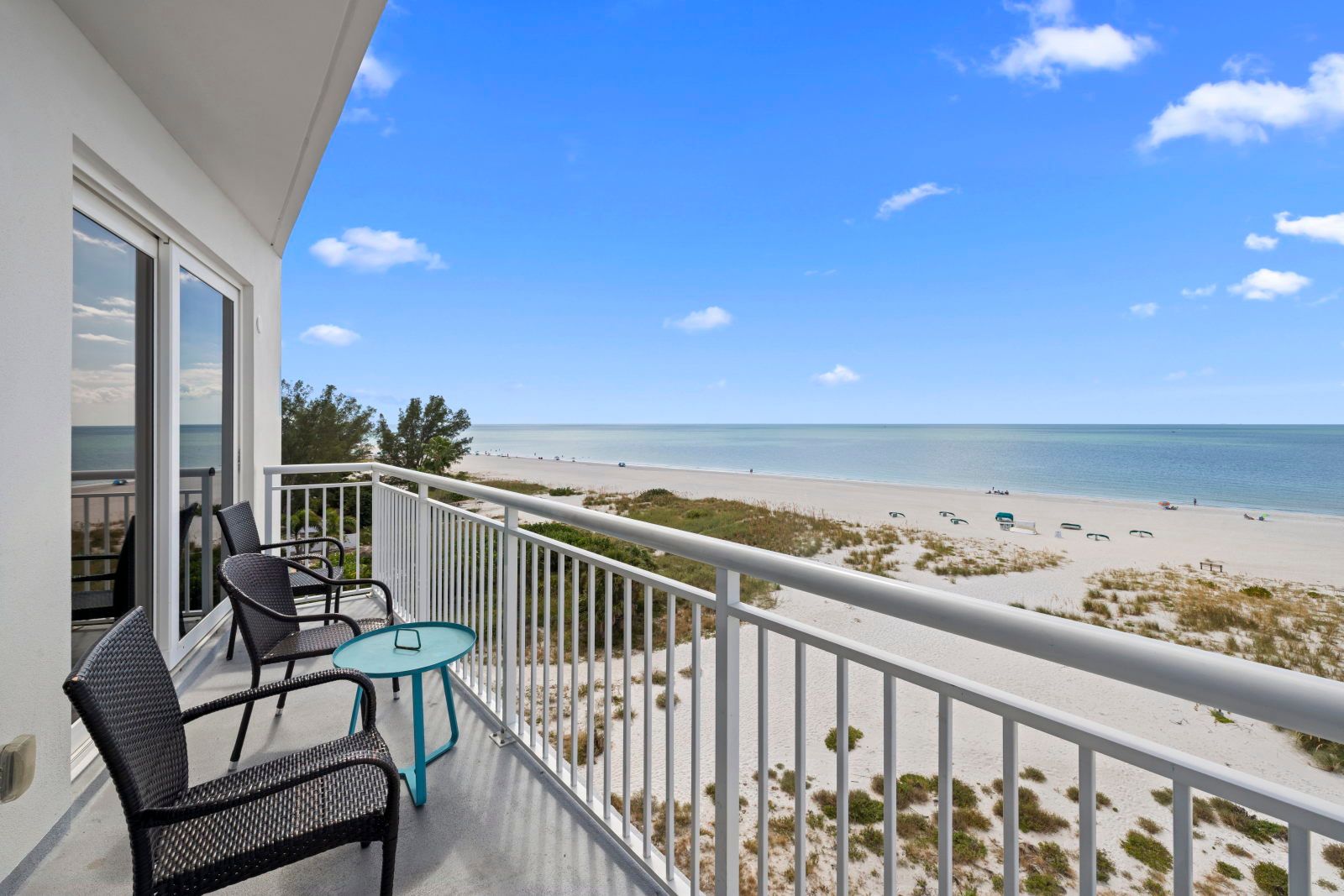 image Sip your morning coffee on the balcony while soaking in the tranquil beach views just steps away.