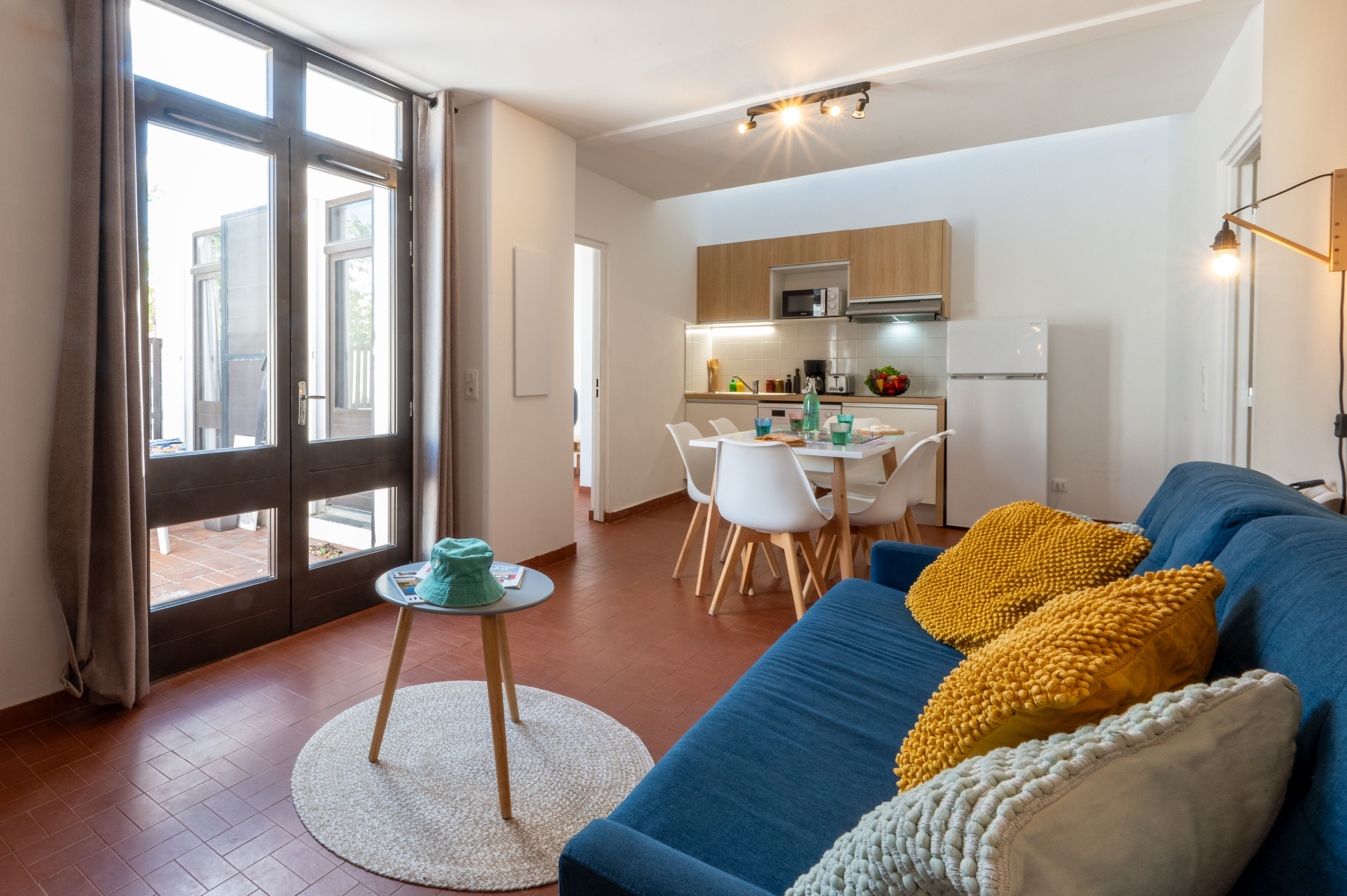image Bright and open living area with sofa bed — air conditioned and designed for comfortable coastal living.