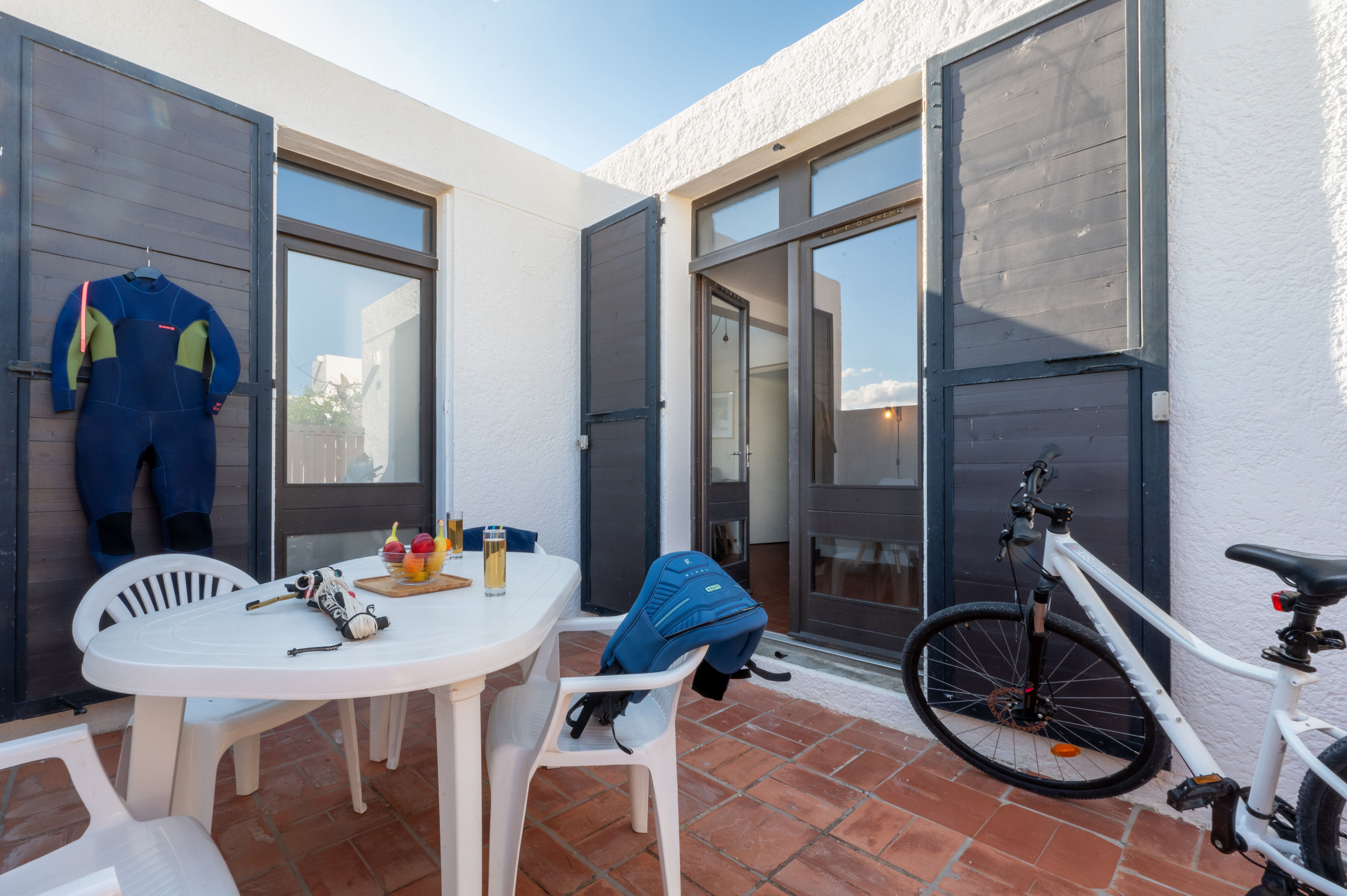 image The private terrace with garden furniture and bike storage — step outside and embrace the car-free spirit of the residence.