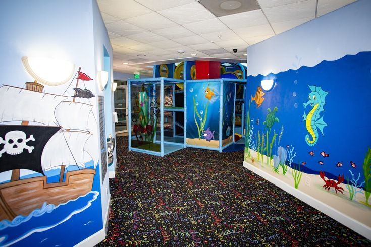 image Dive into a whimsical undersea world with playful murals that create a lively atmosphere.