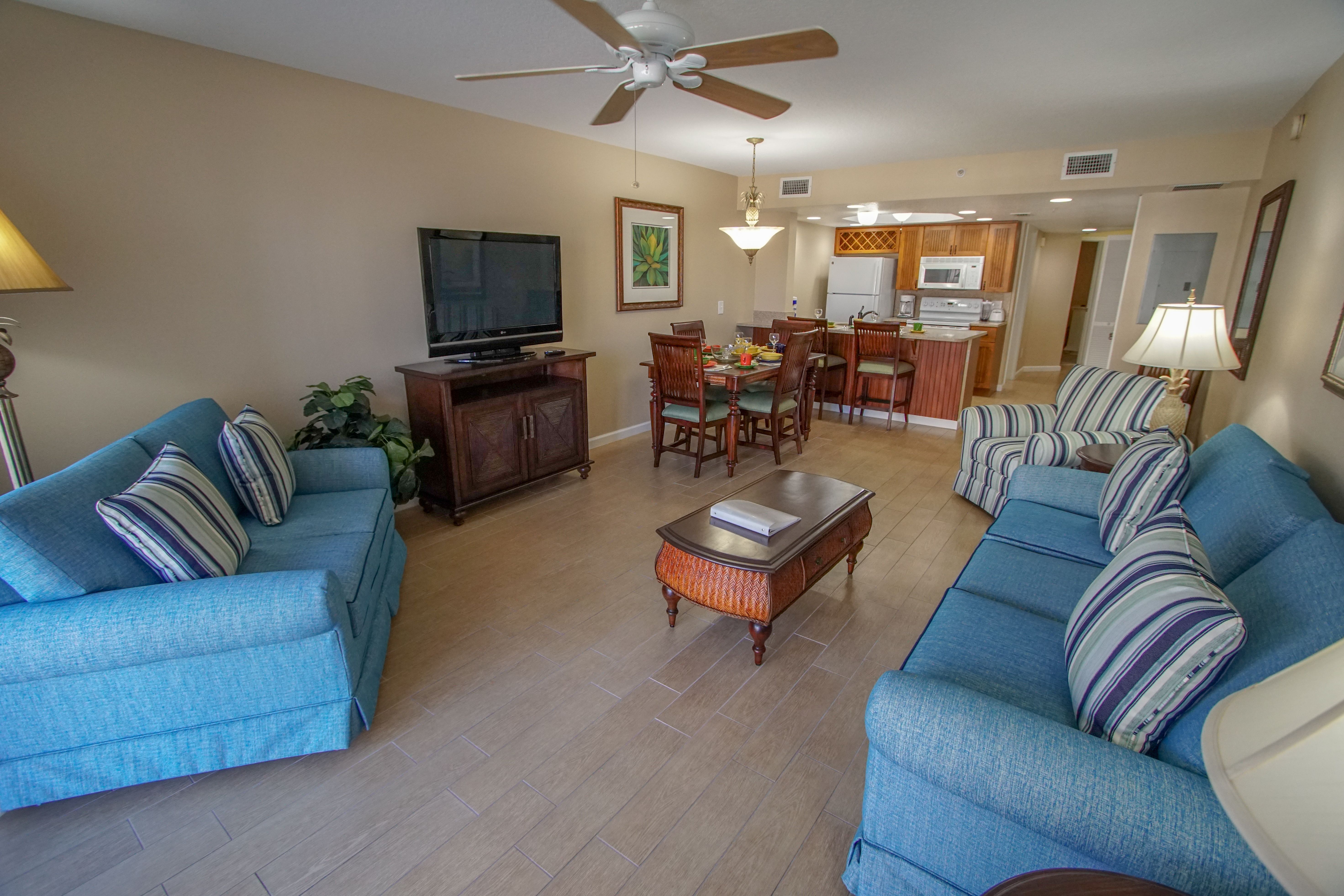 image Relax in a spacious living area with stylish furnishings, perfect for entertaining or lounging after a day at the beach.