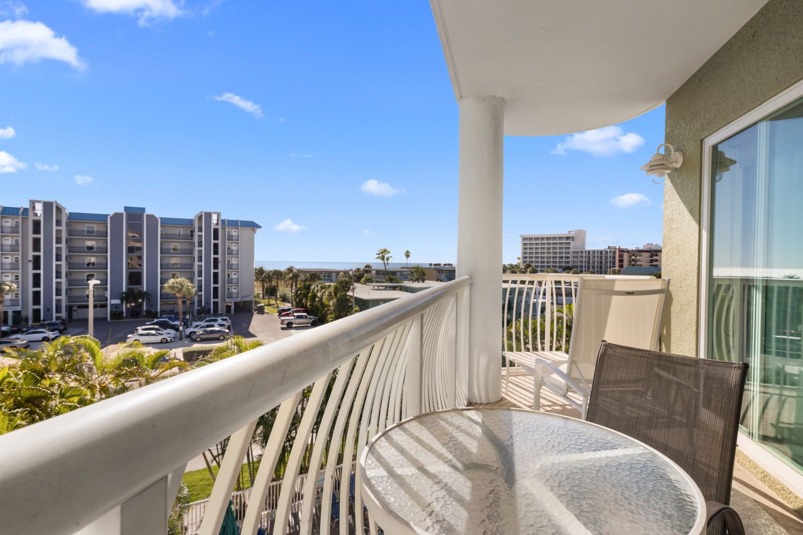 image Sip your morning coffee on the private balcony overlooking the pool.