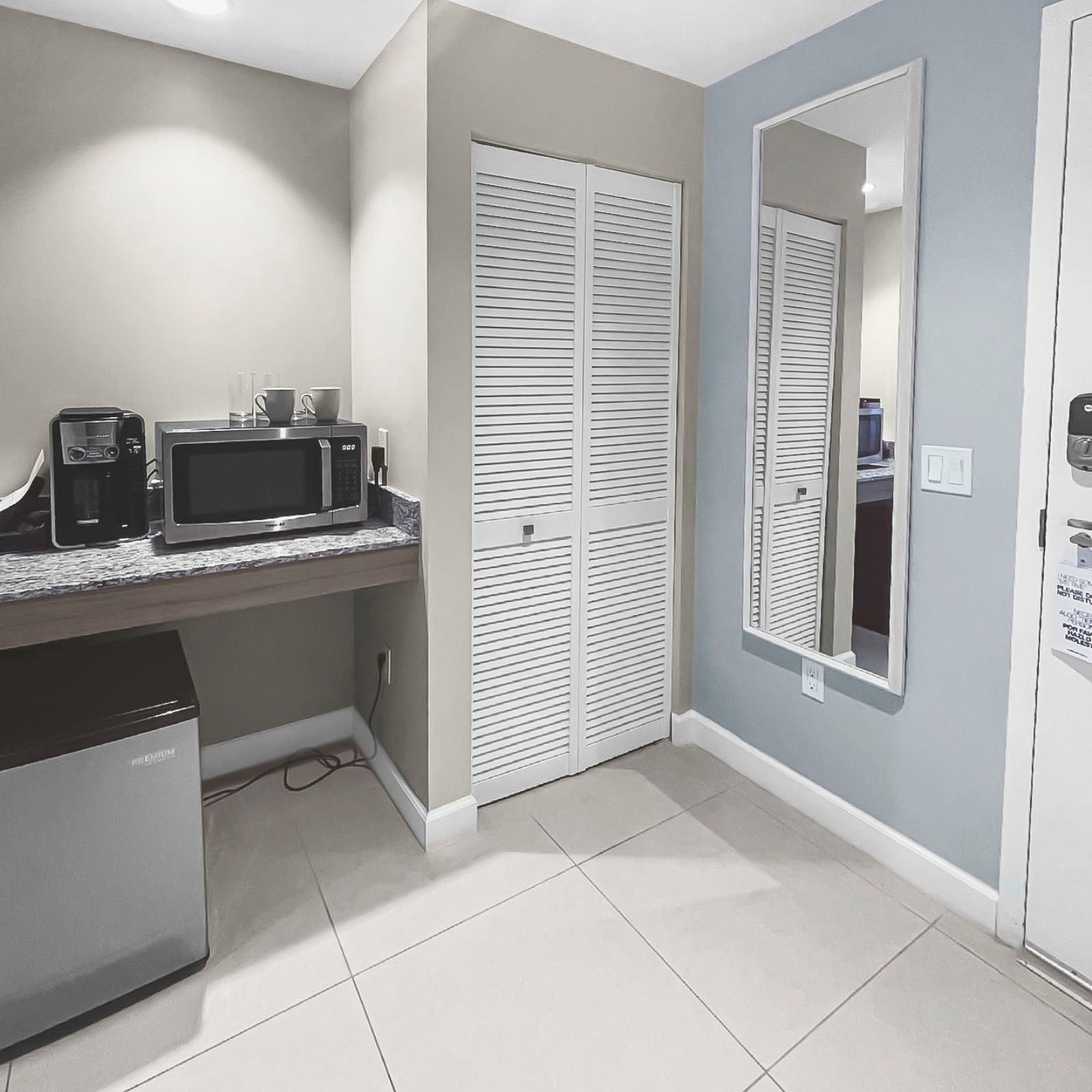 image Enjoy a cozy kitchenette featuring sleek appliances, perfect for light meals and snacks.