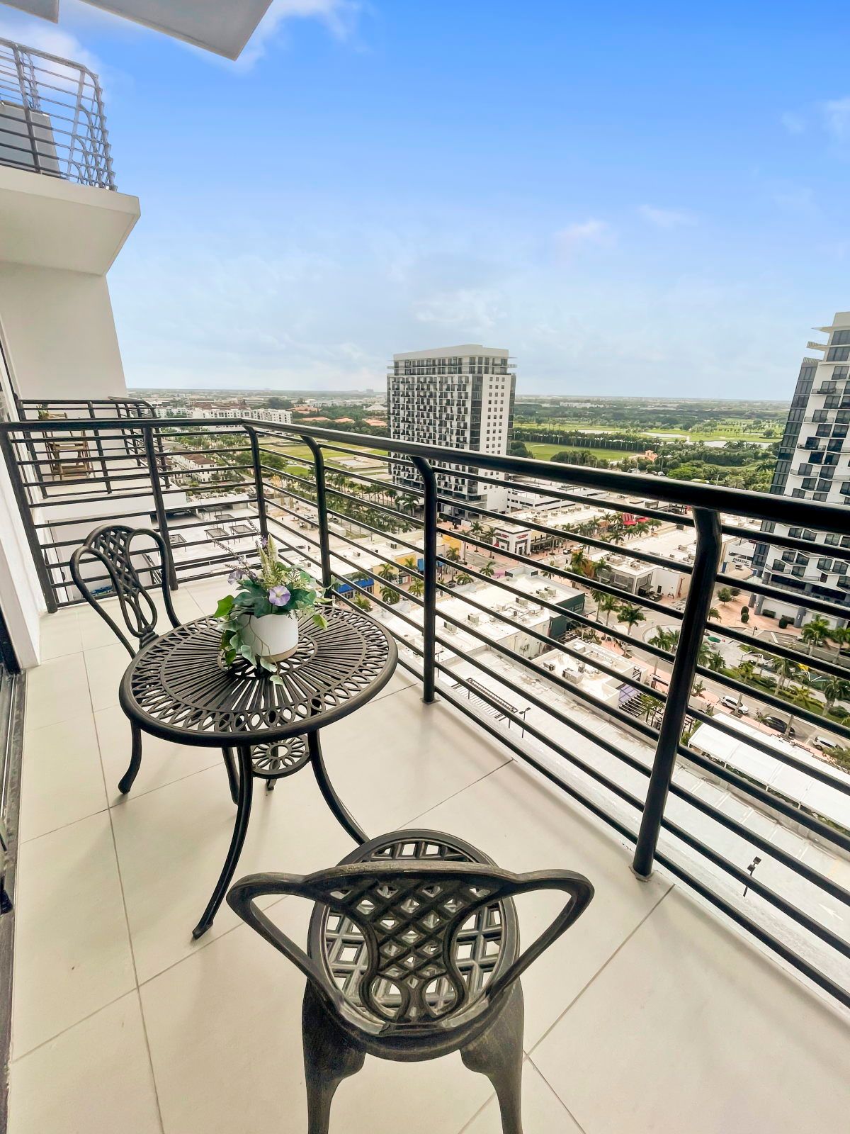 image Enjoy coffee on the balcony while soaking in the vibrant atmosphere below.