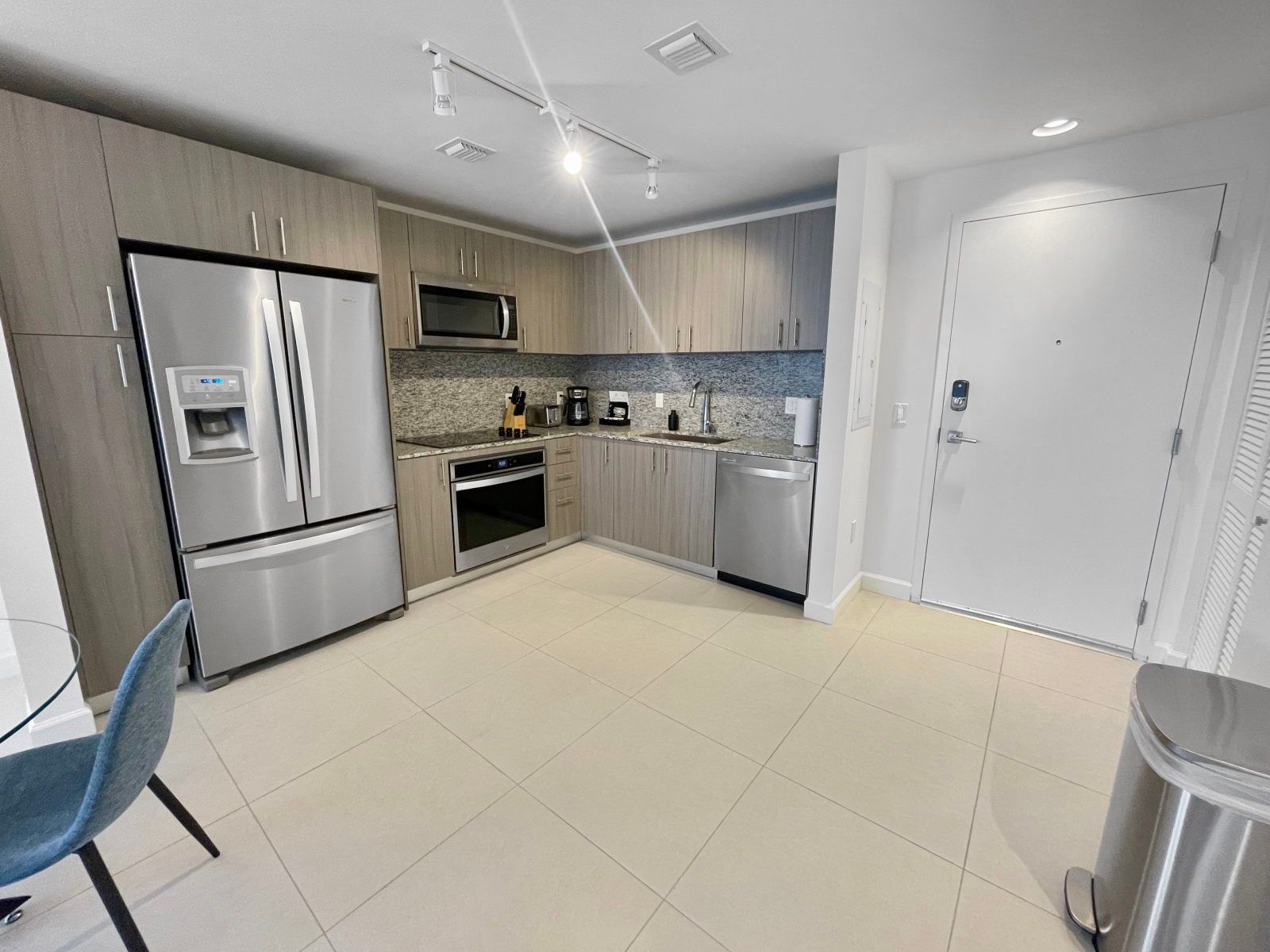 image Cook up a feast in this full kitchen, boasting stainless steel appliances and ample counter space for meal prep.