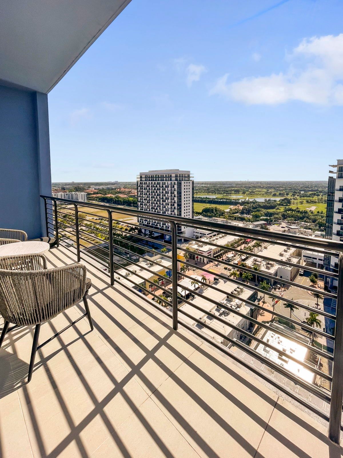 image Relax on your private balcony and enjoy the views, sipping coffee while the world below bustles.