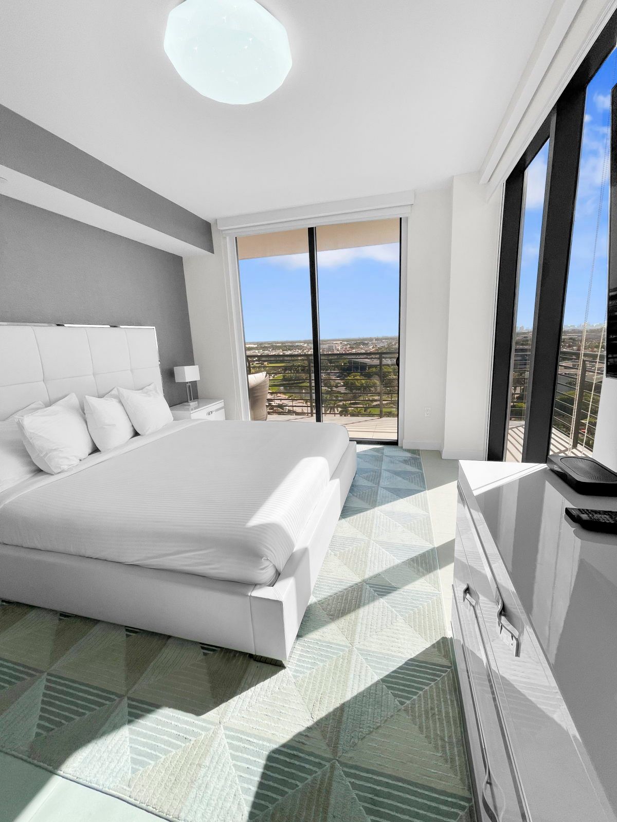 image Relax in this cozy bedroom, featuring a plush king bed and natural light filling the space.