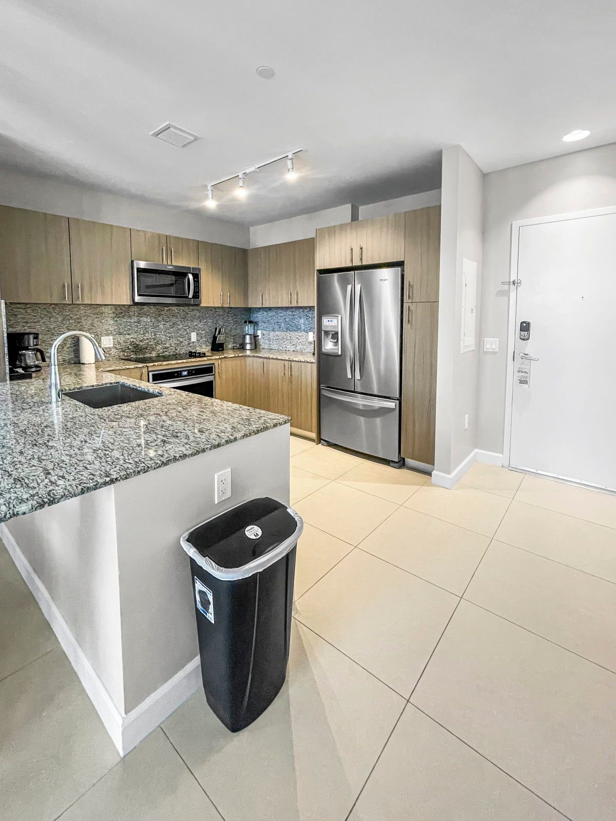 image Cook up a storm in the full kitchen, featuring modern appliances and ample counter space for meal prep.