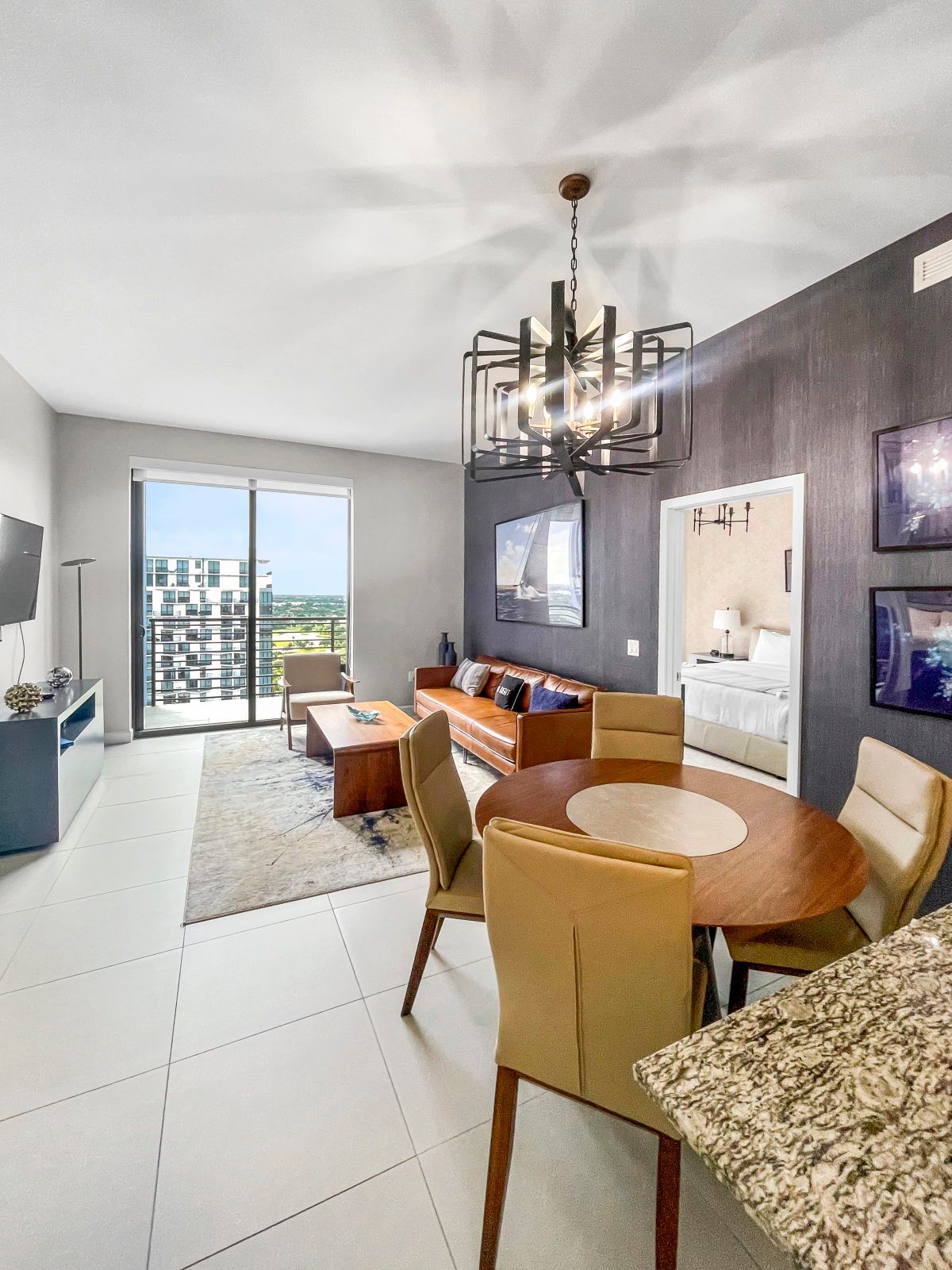 image Relax in the stylish living area, complete with contemporary furnishings and a sleek dining setup.