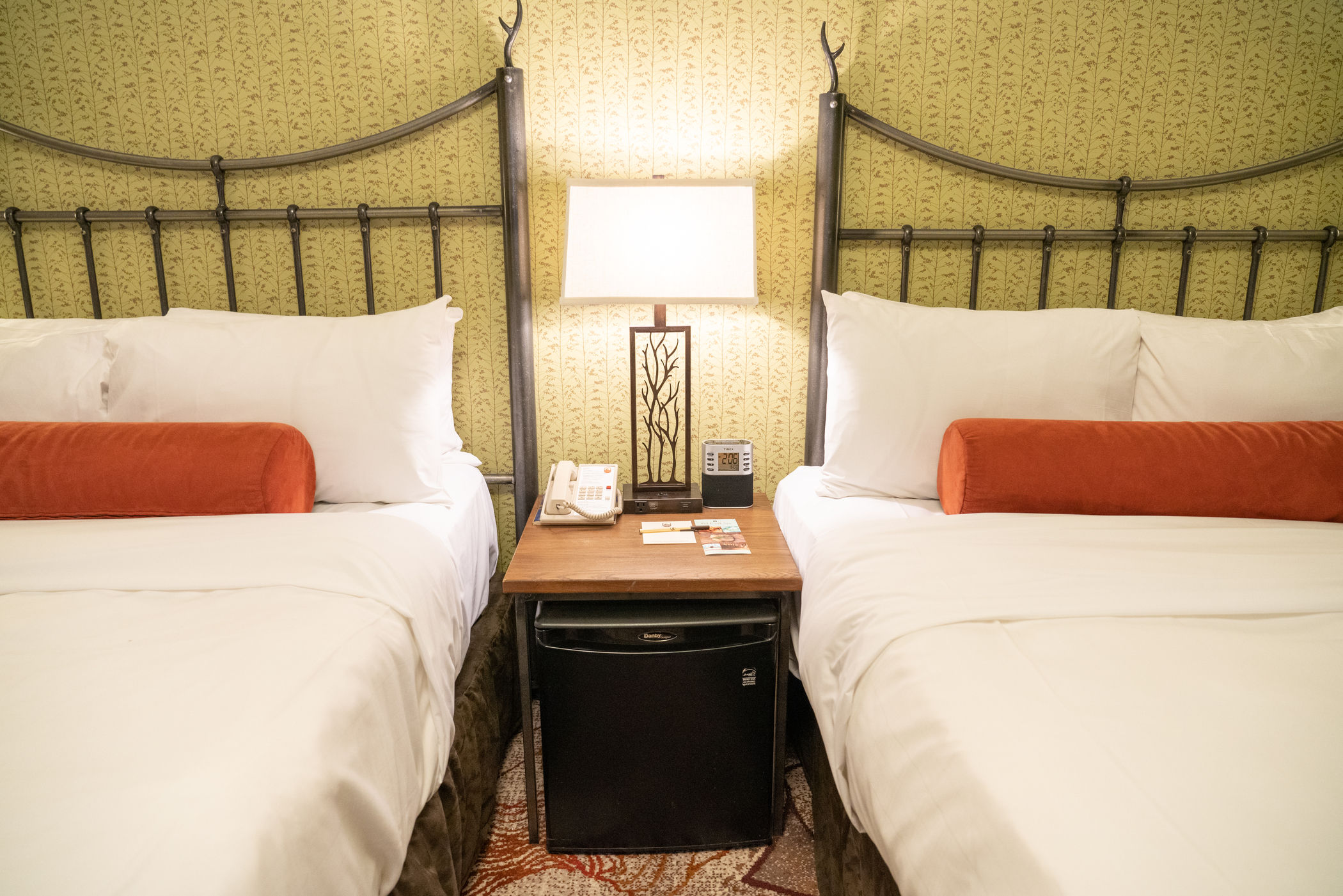 image Two double beds with Mountain Luxury bedding — made up fresh each day after your adventures in Banff National Park.