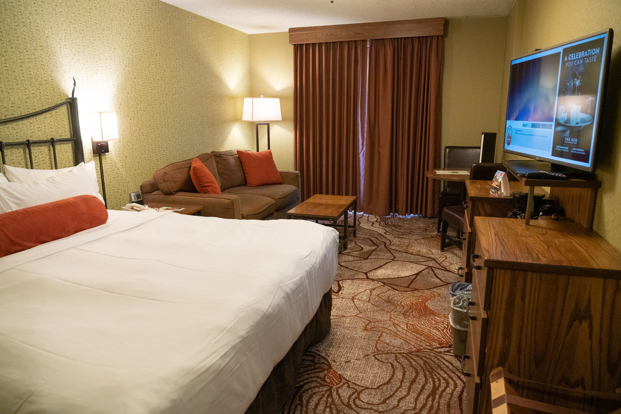 image Flatscreen TV and mini fridge for a quiet evening in — The Keg downstairs if you'd rather let someone else cook
