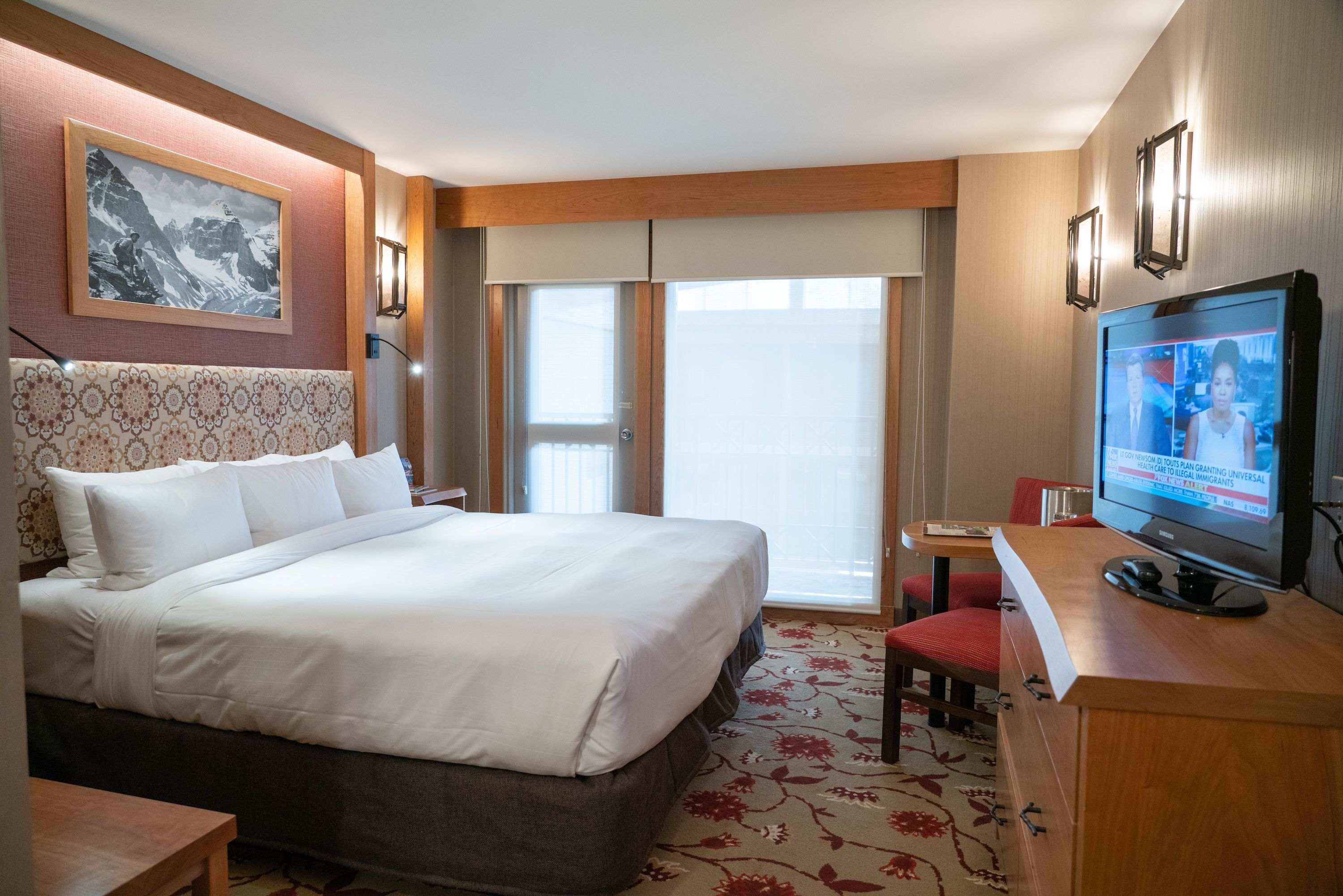 image King Mountain Luxury bed steps from Banff Avenue — brew a tea, head out to the balcony, and take in the mountain air
