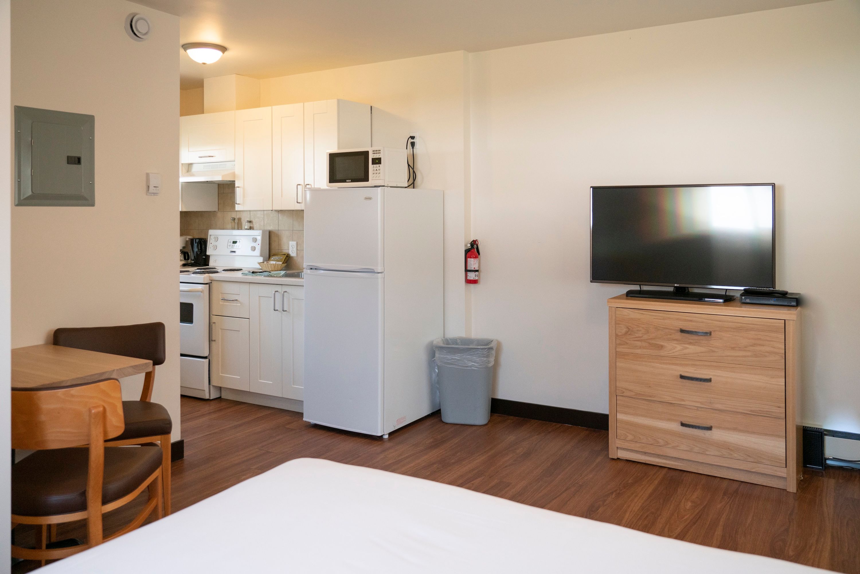 image Flat-screen TV and dining area, with kitchen and full amenities just steps away