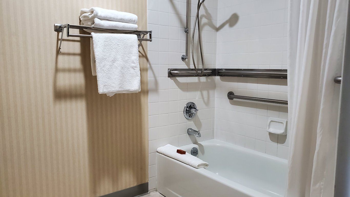 image Well-equipped bathroom with towel storage and step-free access features.