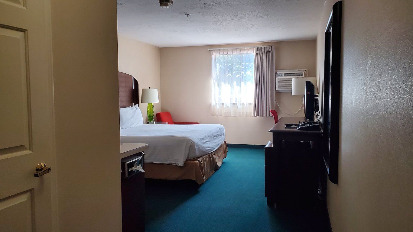 image King room with ergonomic workspace, reading chair, and modern in-room amenities.