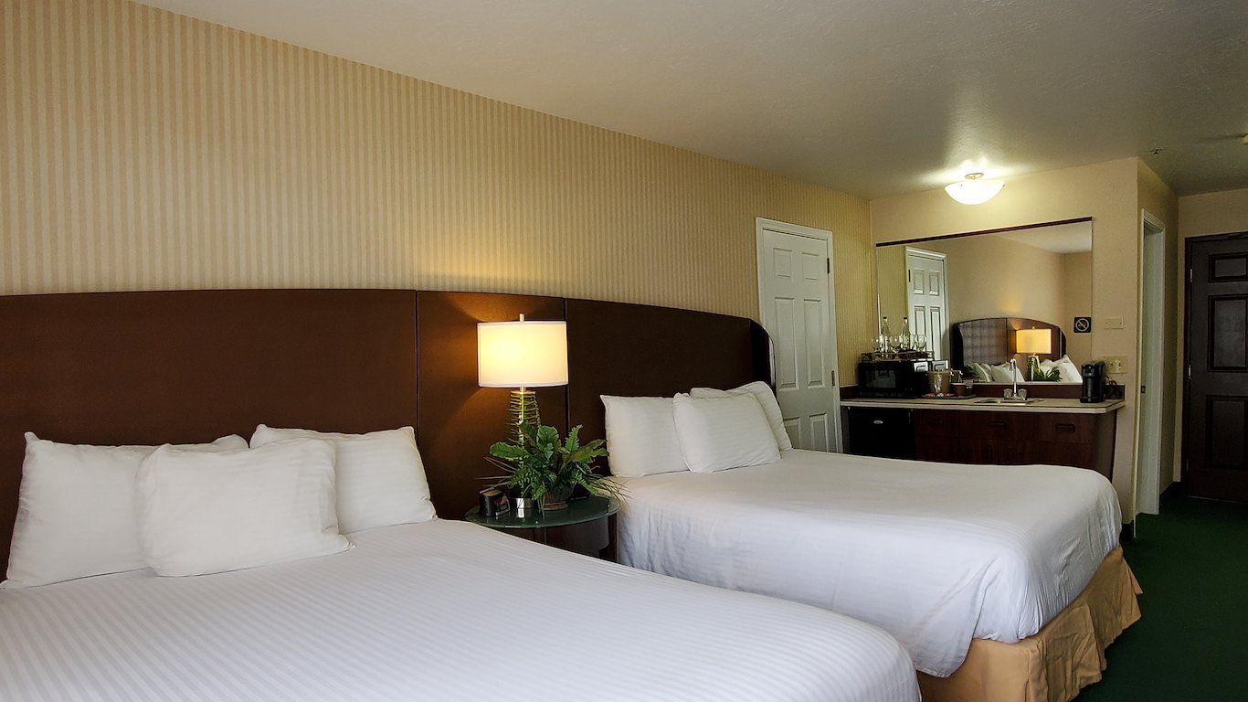 image Two queen beds with easy access to the in-room wet bar and mini fridge.