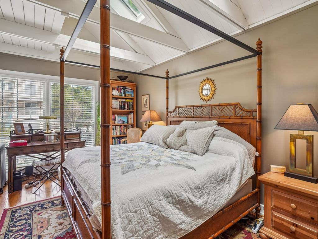 image Master bedroom with a king bed, reading nook, and work desk on the main level