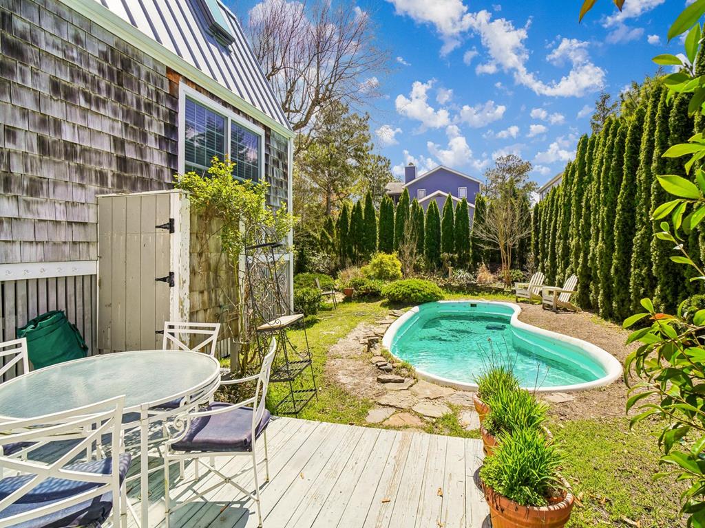 image Pool with sun loungers and green surround — all yours after a morning on the beach