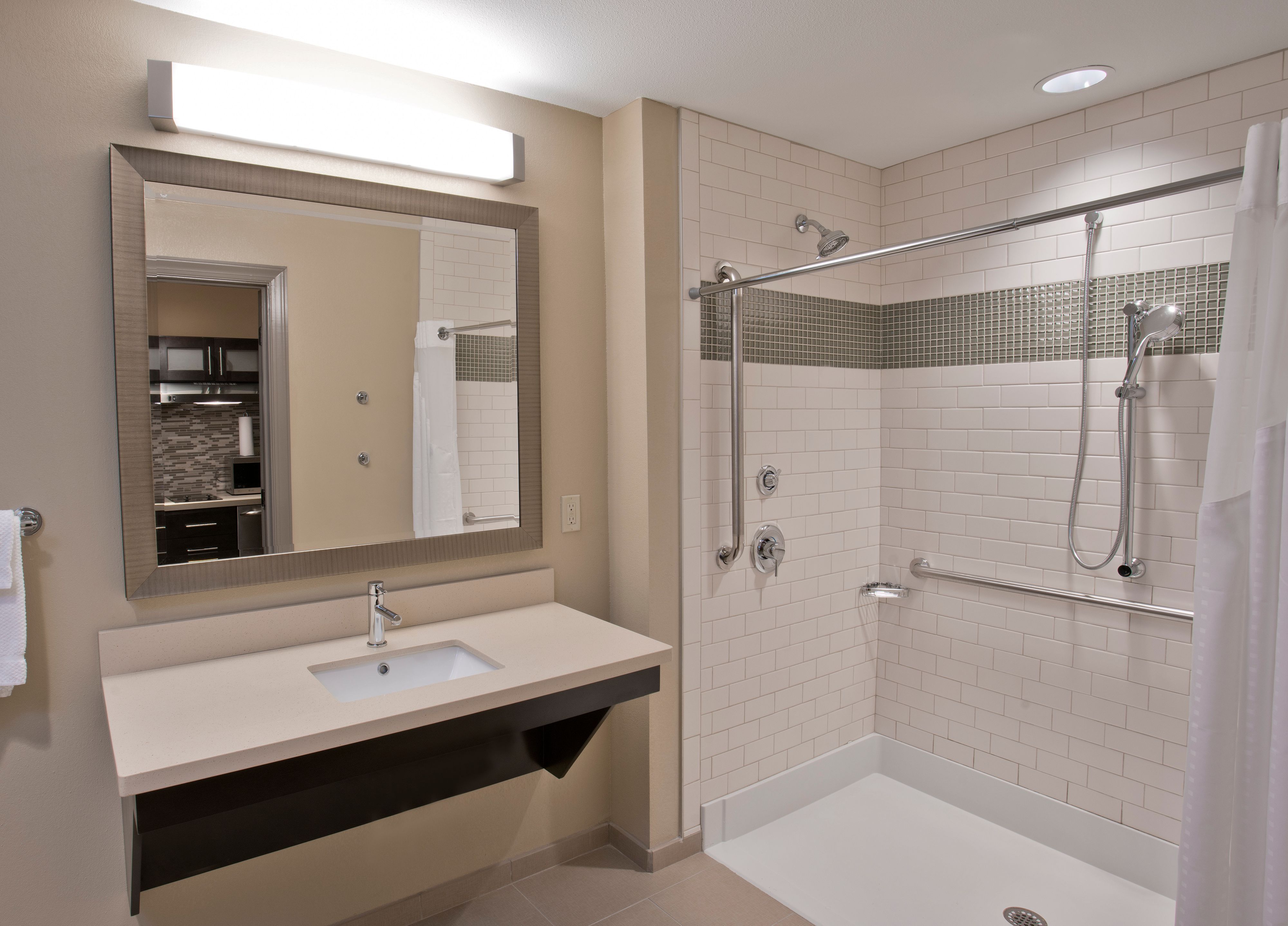 image Well-appointed bathroom with a spacious shower and accessible fixtures.