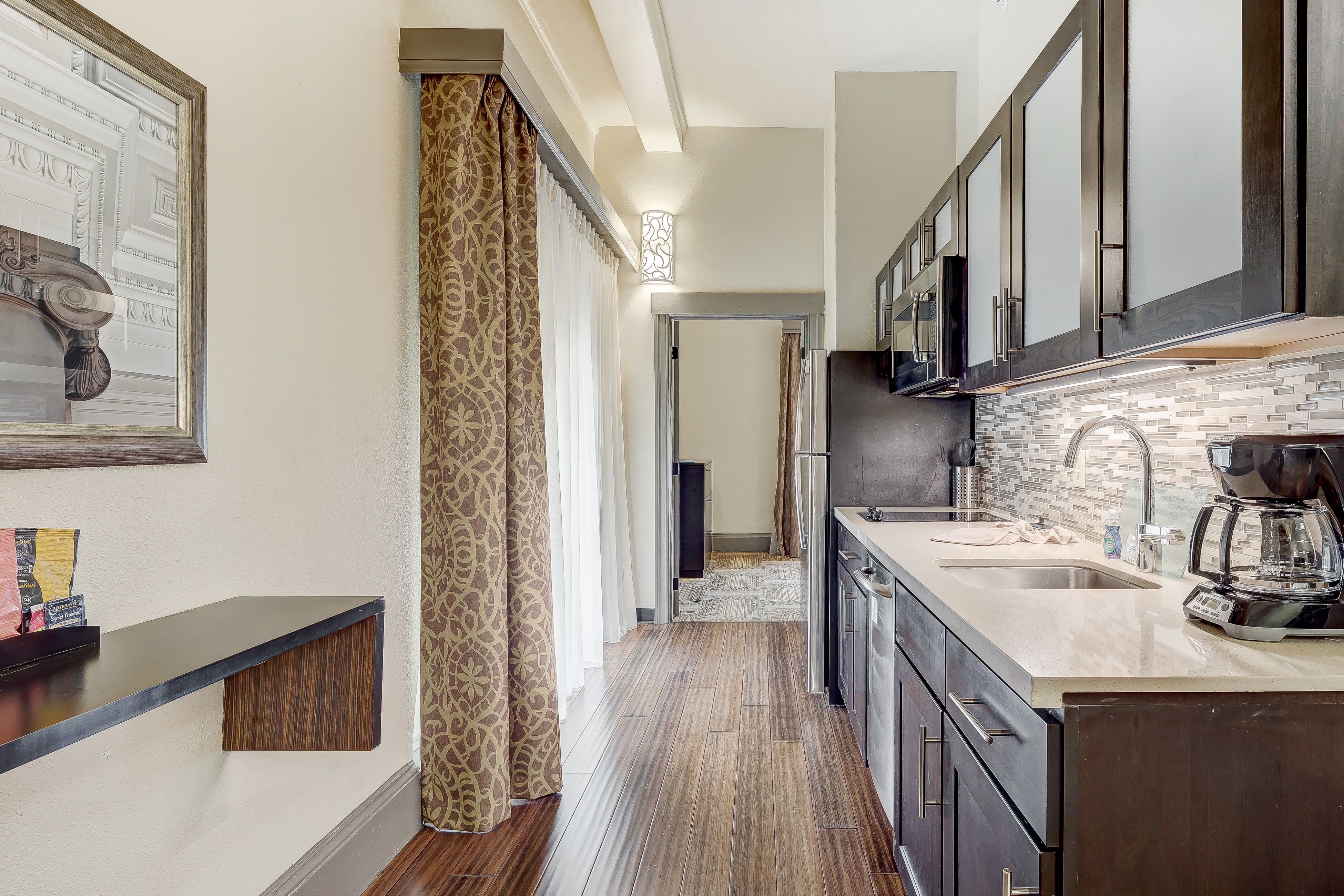image Stylish kitchen featuring sleek cabinetry and modern appliances.