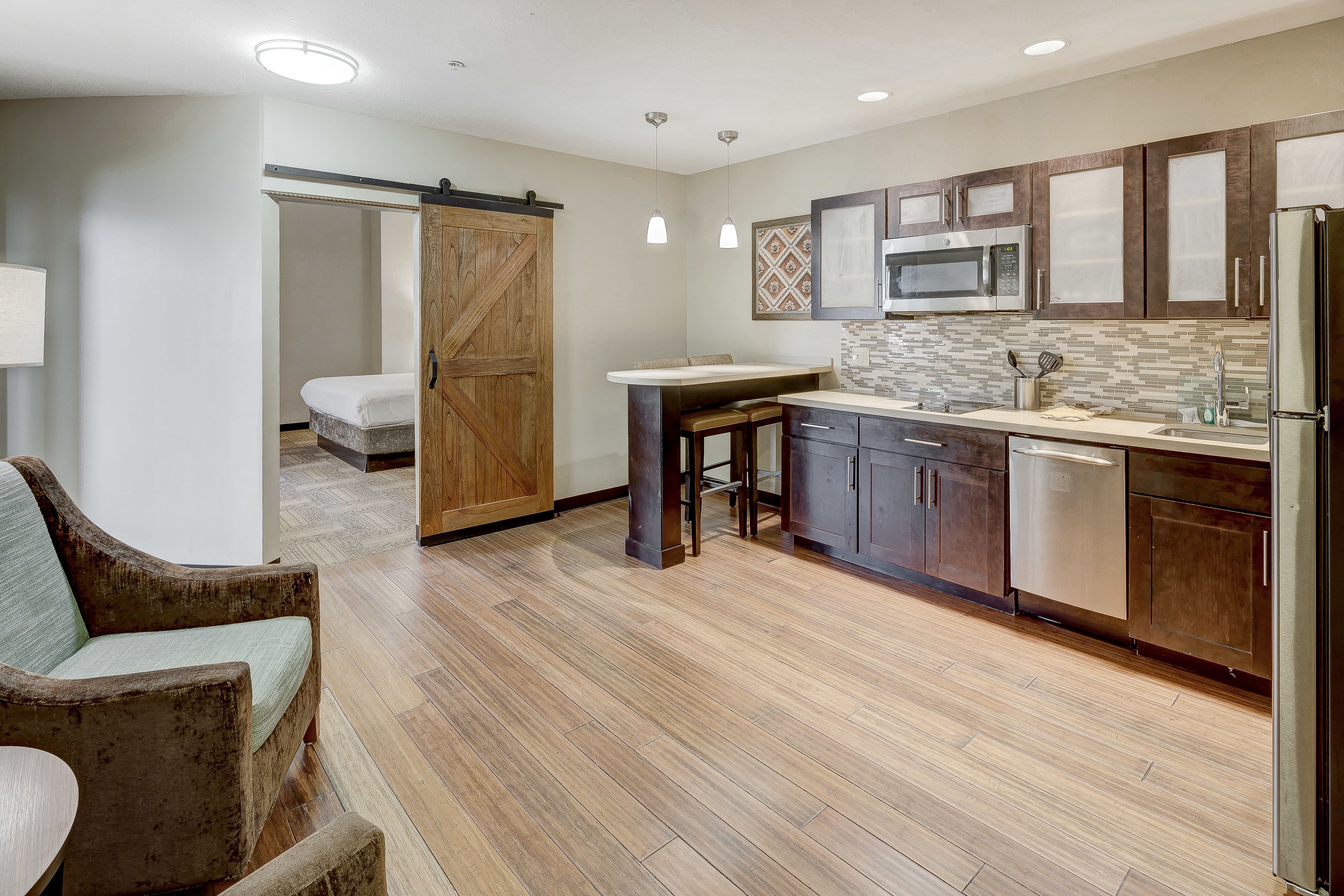 image Stylish kitchen and dining area ideal for family meals and gatherings.