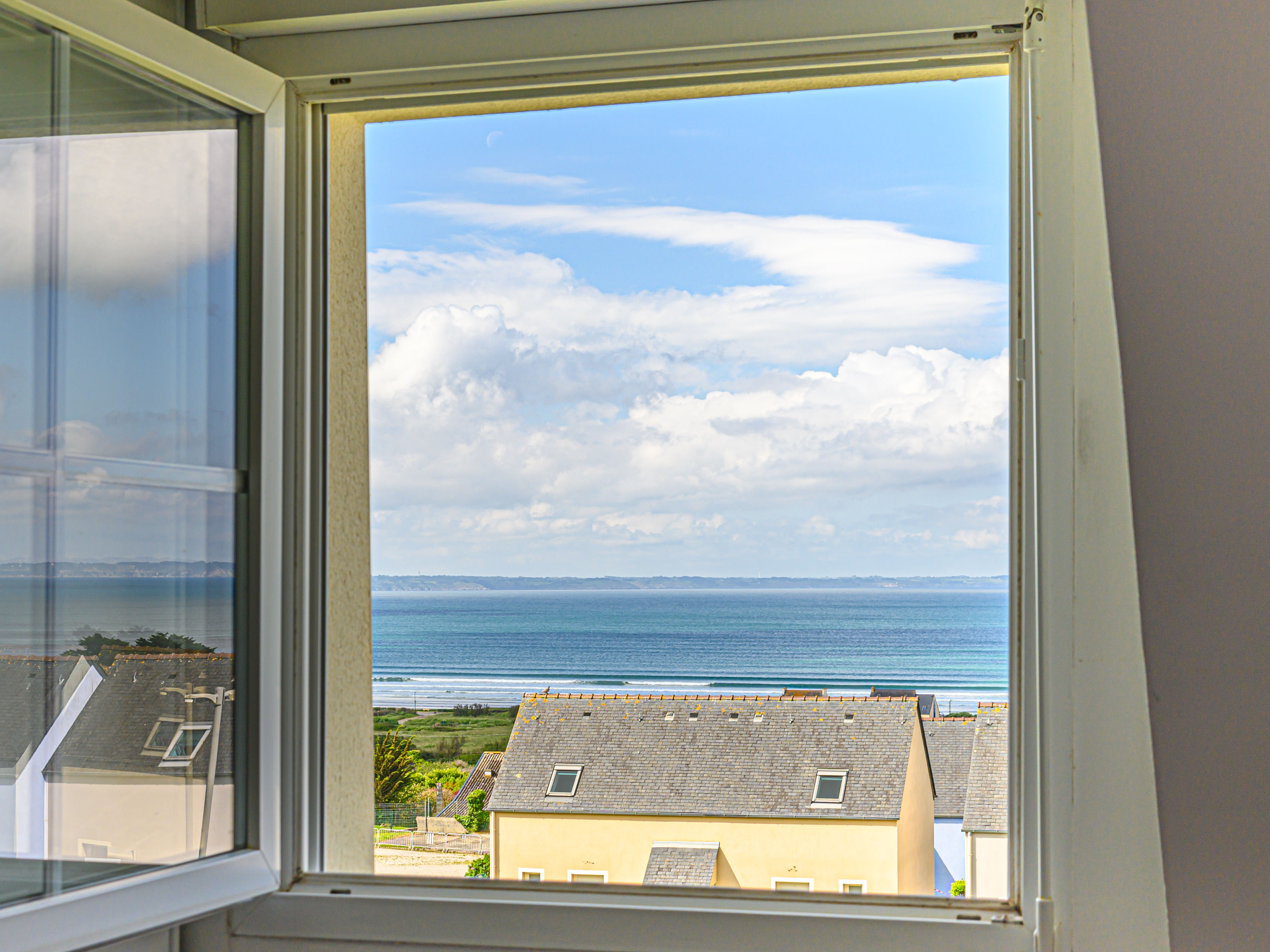 image Upper-floor window framing the Bay of Douarnenez — sea views from the moment you wake up