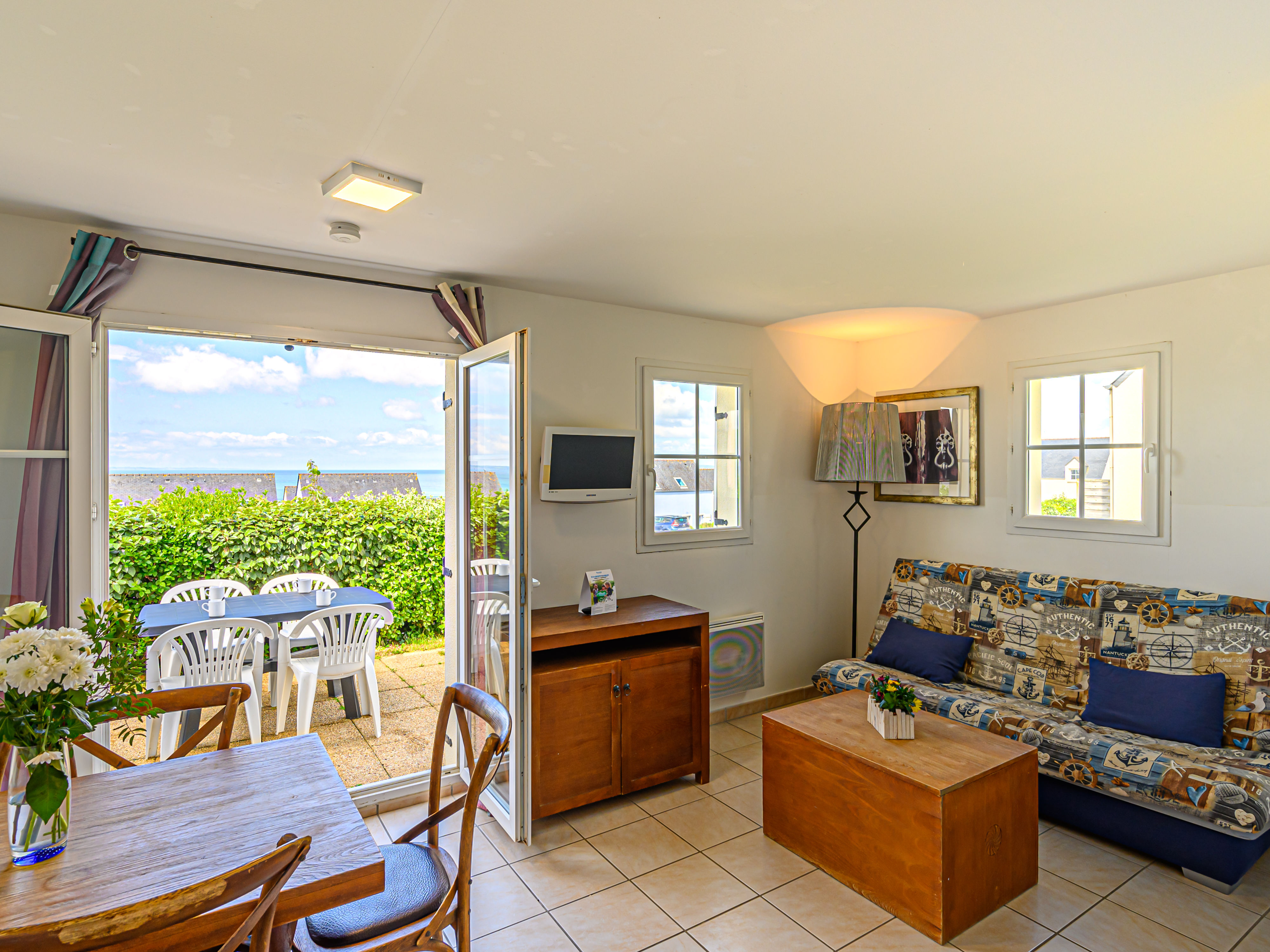 image Bright living room with sea views — the sofa bed pulls out for extra guests, and the terrace is just steps away