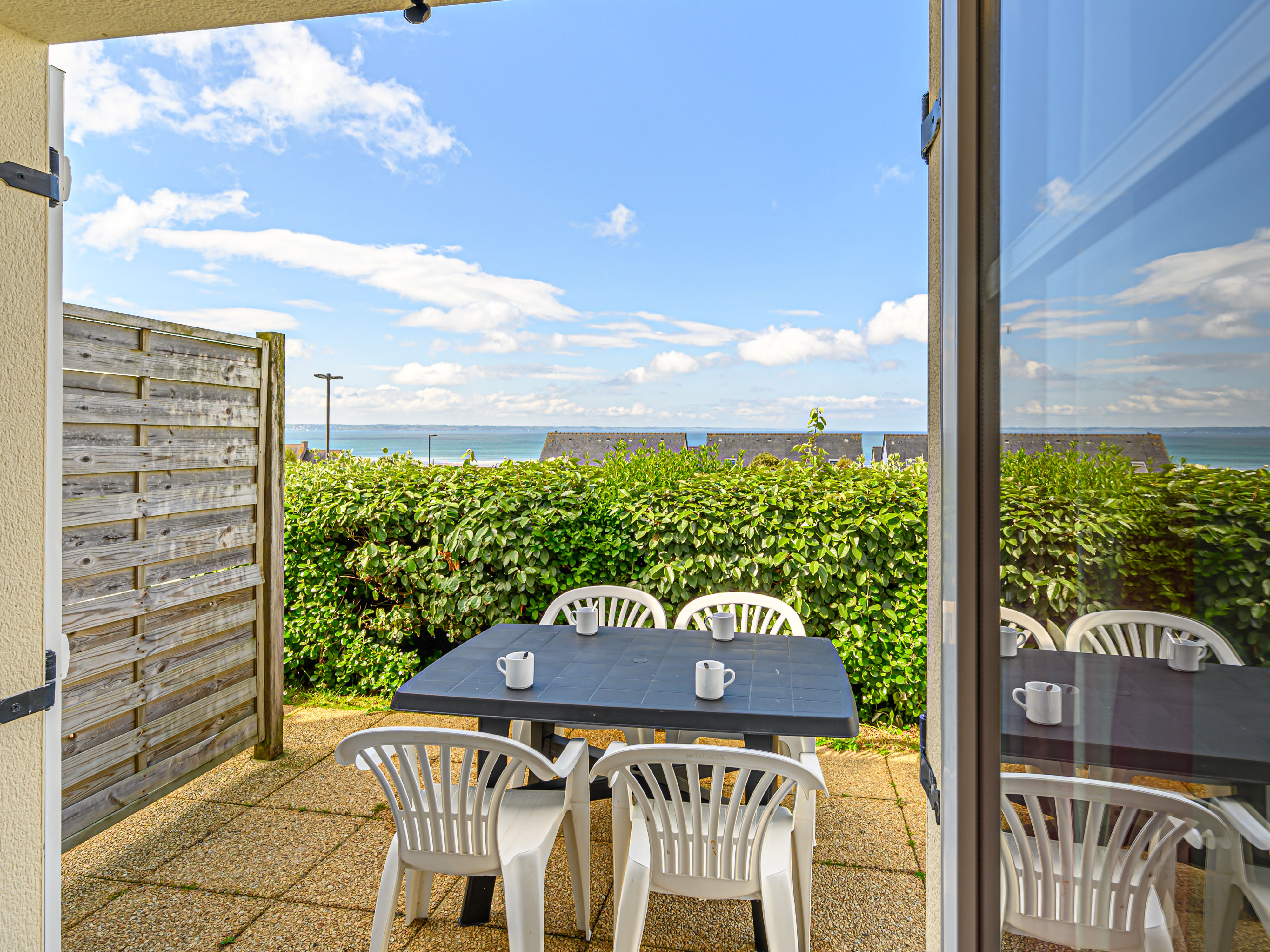 image Gather around the outdoor table for morning coffee with the Bay of Douarnenez laid out in front of you