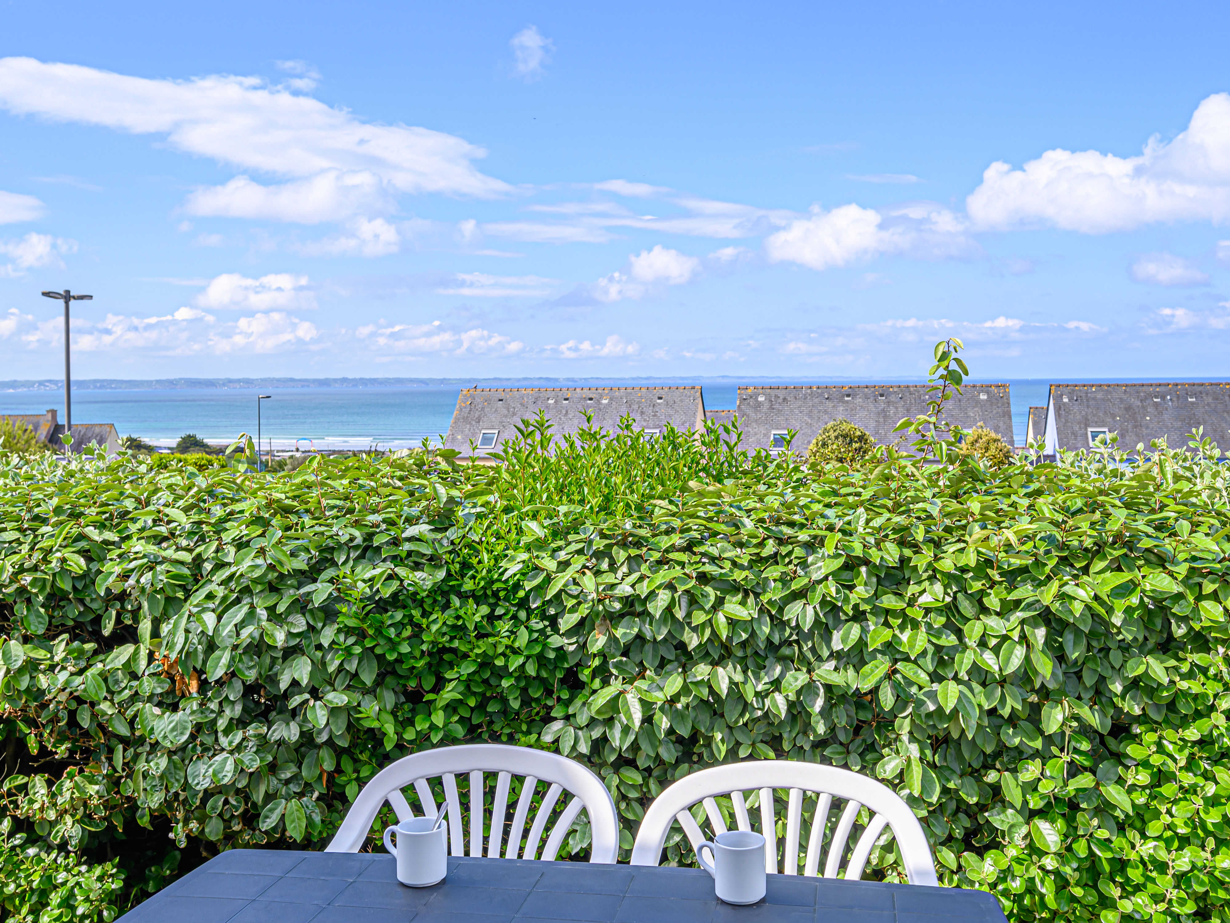 image Terrace with a table and chairs — sea air, sunshine, and views over the bay all day long