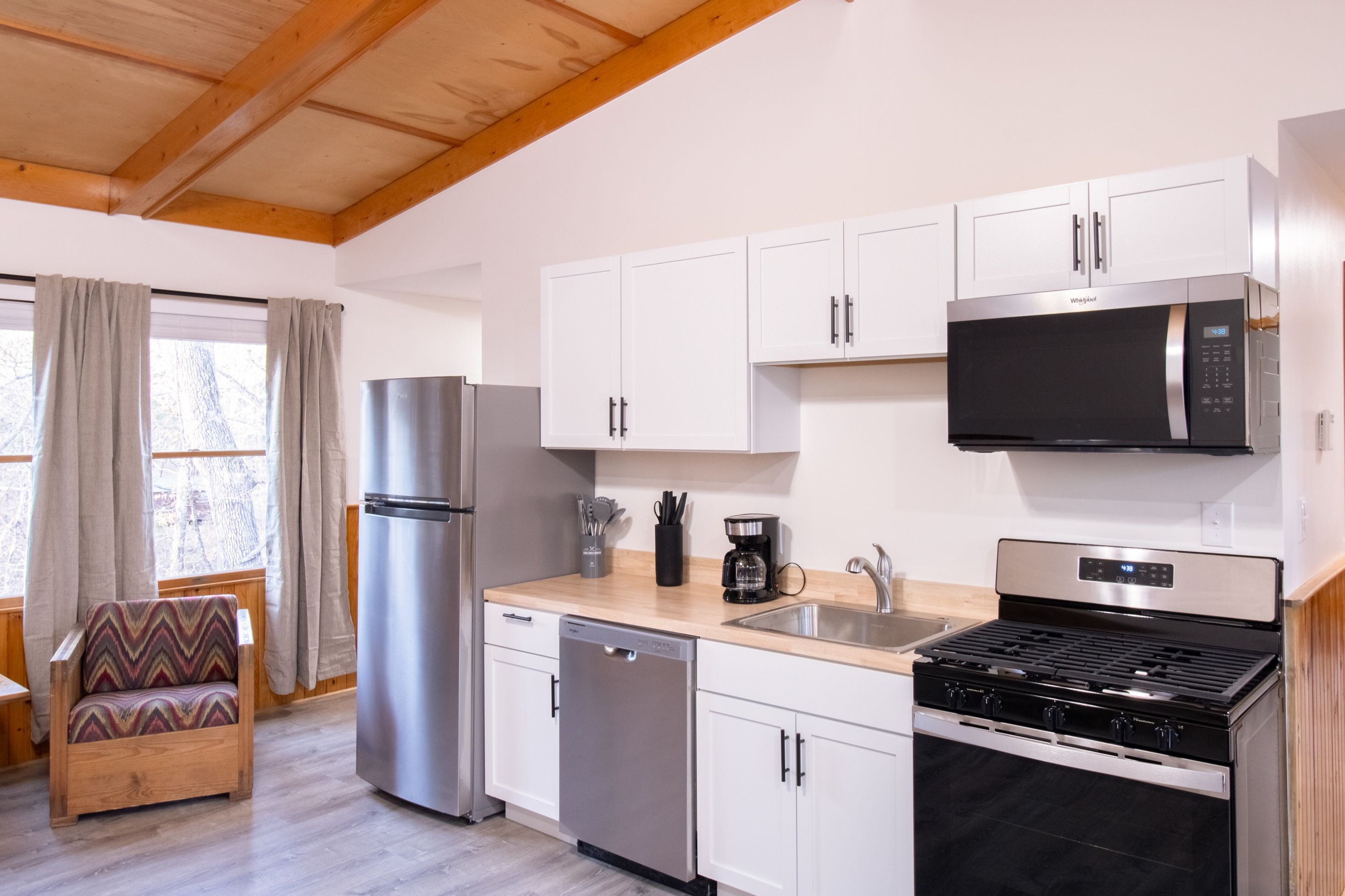 image Cook your favorite meals using the gas range in a bright and inviting kitchen.