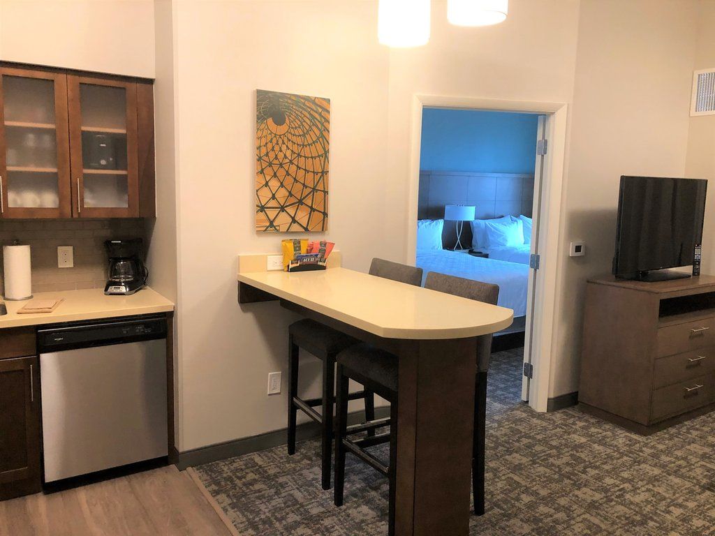 image Two-seat kitchen bar with open sightline to the living area.