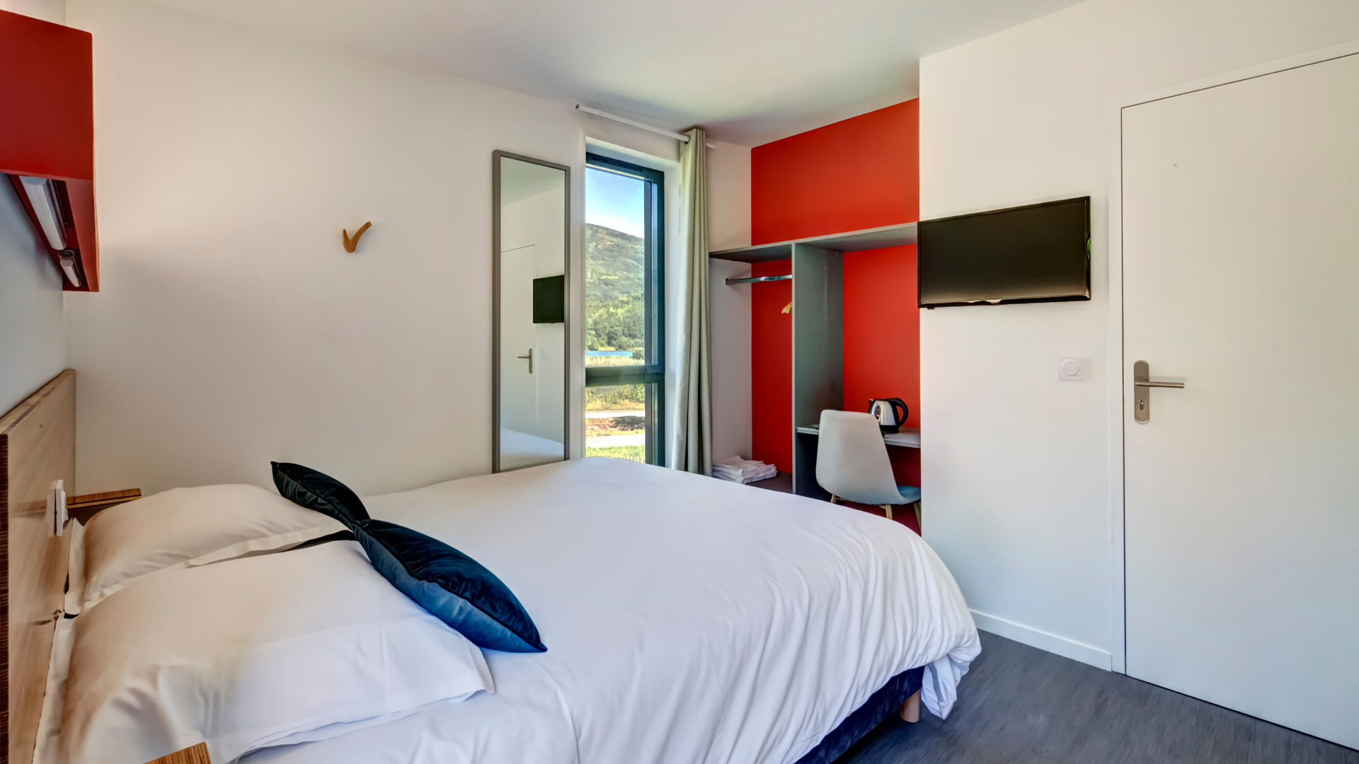 image Double bed bedroom with a bright, colourful headboard and room to unwind after a day at Lac du Bourget