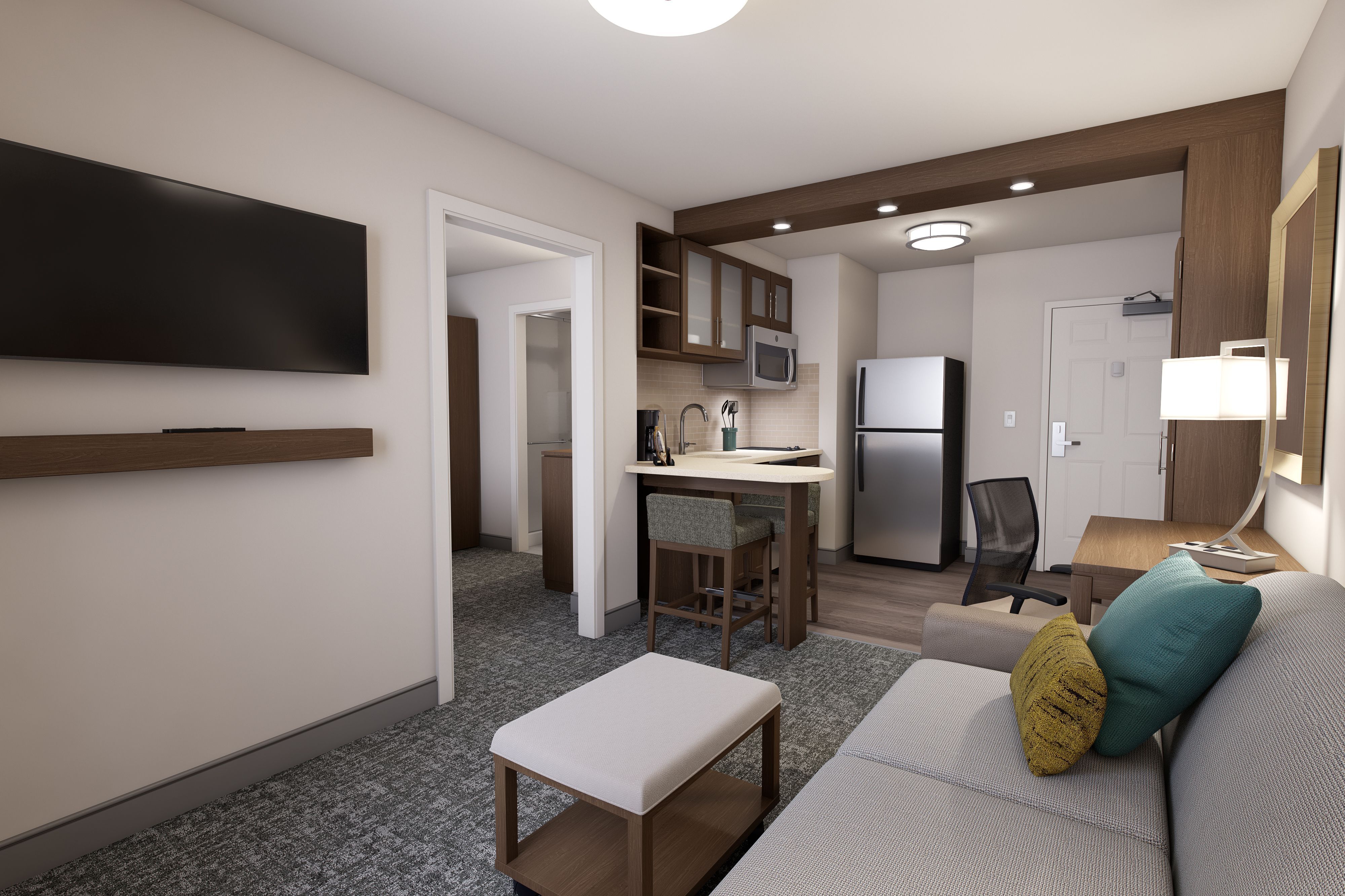 image Inviting suite with a kitchen nook and comfortable seating area.