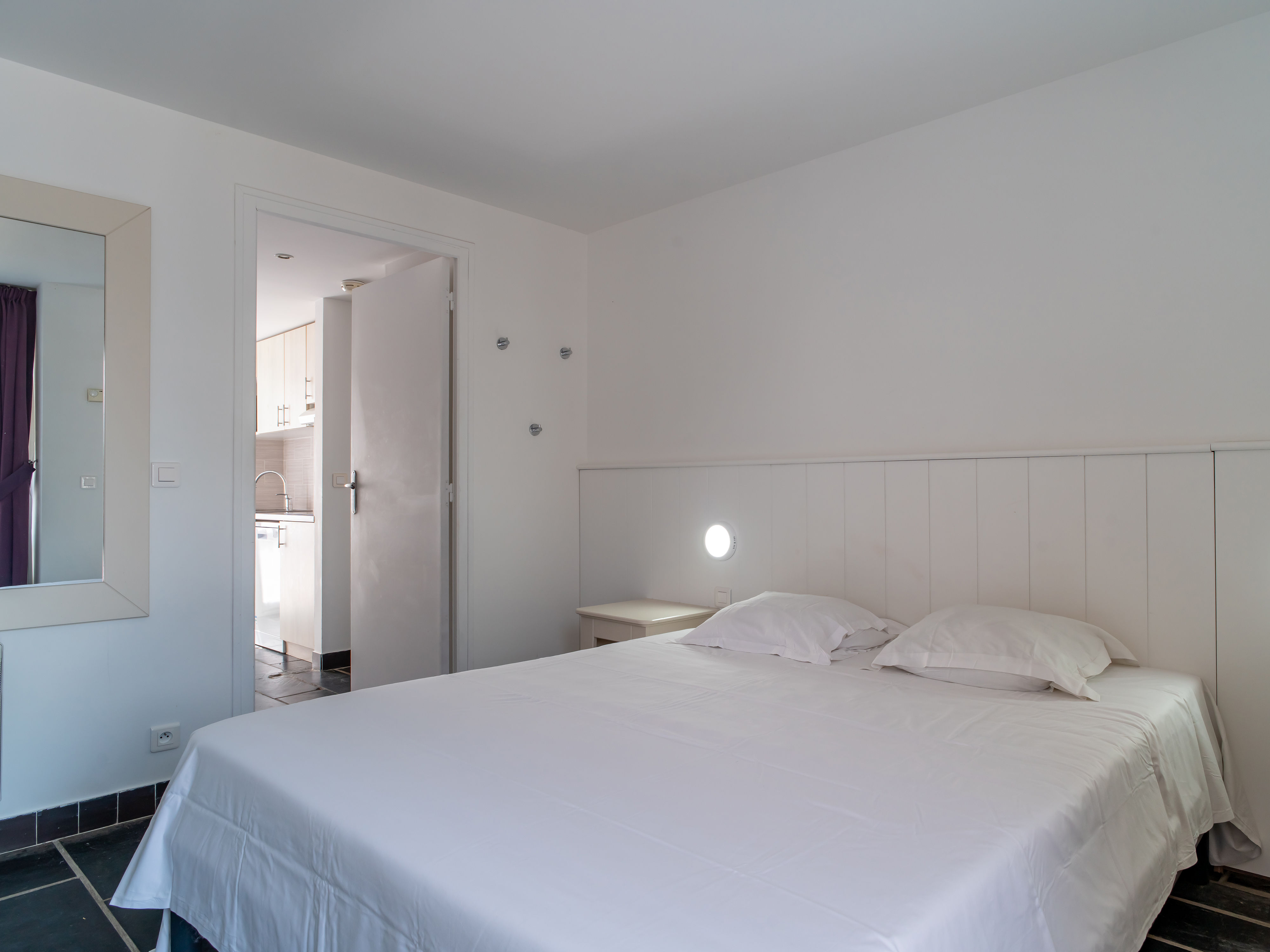 image Double bed in the main bedroom — unpack, settle in, and head down to the beach