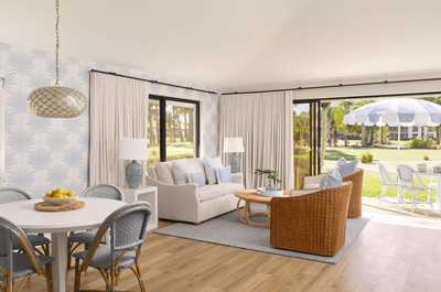 Bistro table and chairs on your private terrace — the spot for morning coffee before teeing off