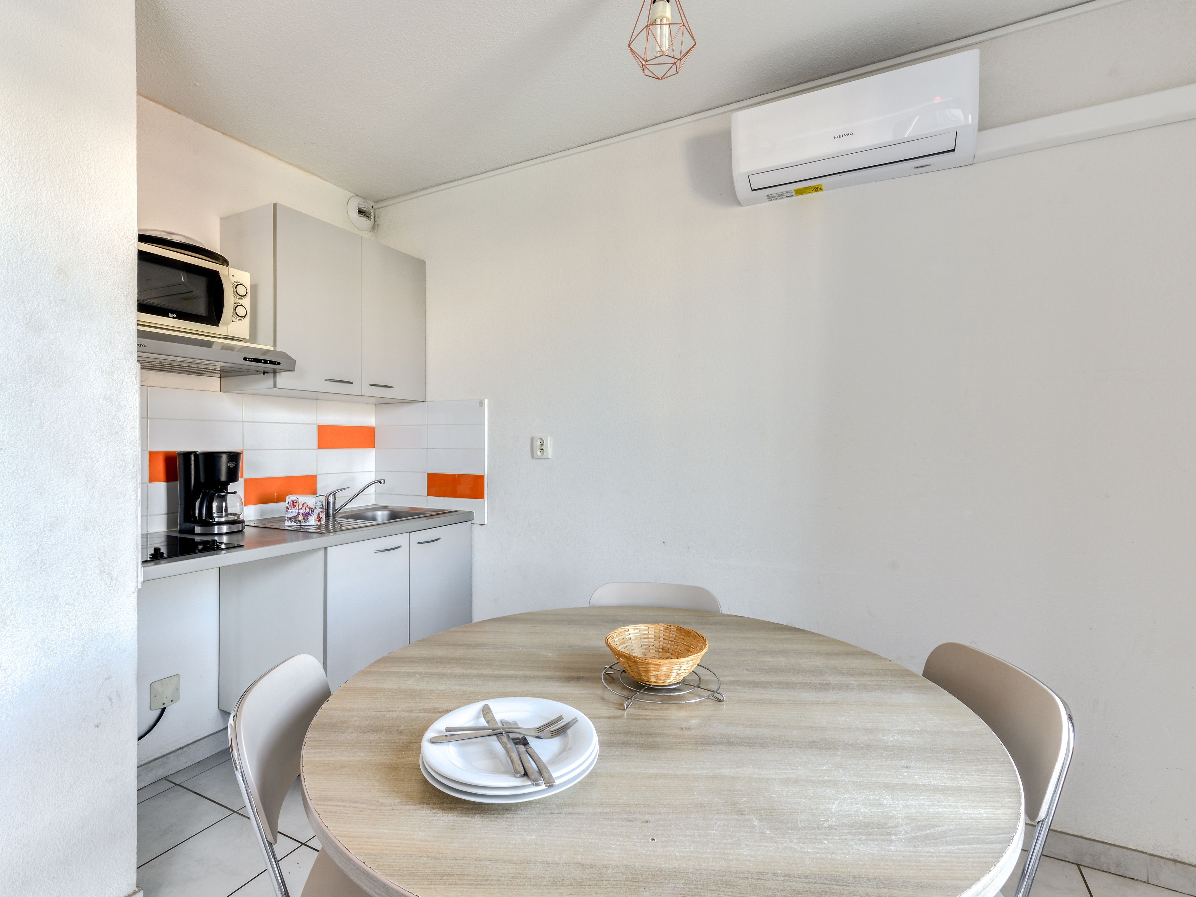 image Kitchenette with ceramic hob, microwave, filter coffee maker, and kettle for self-catered stays