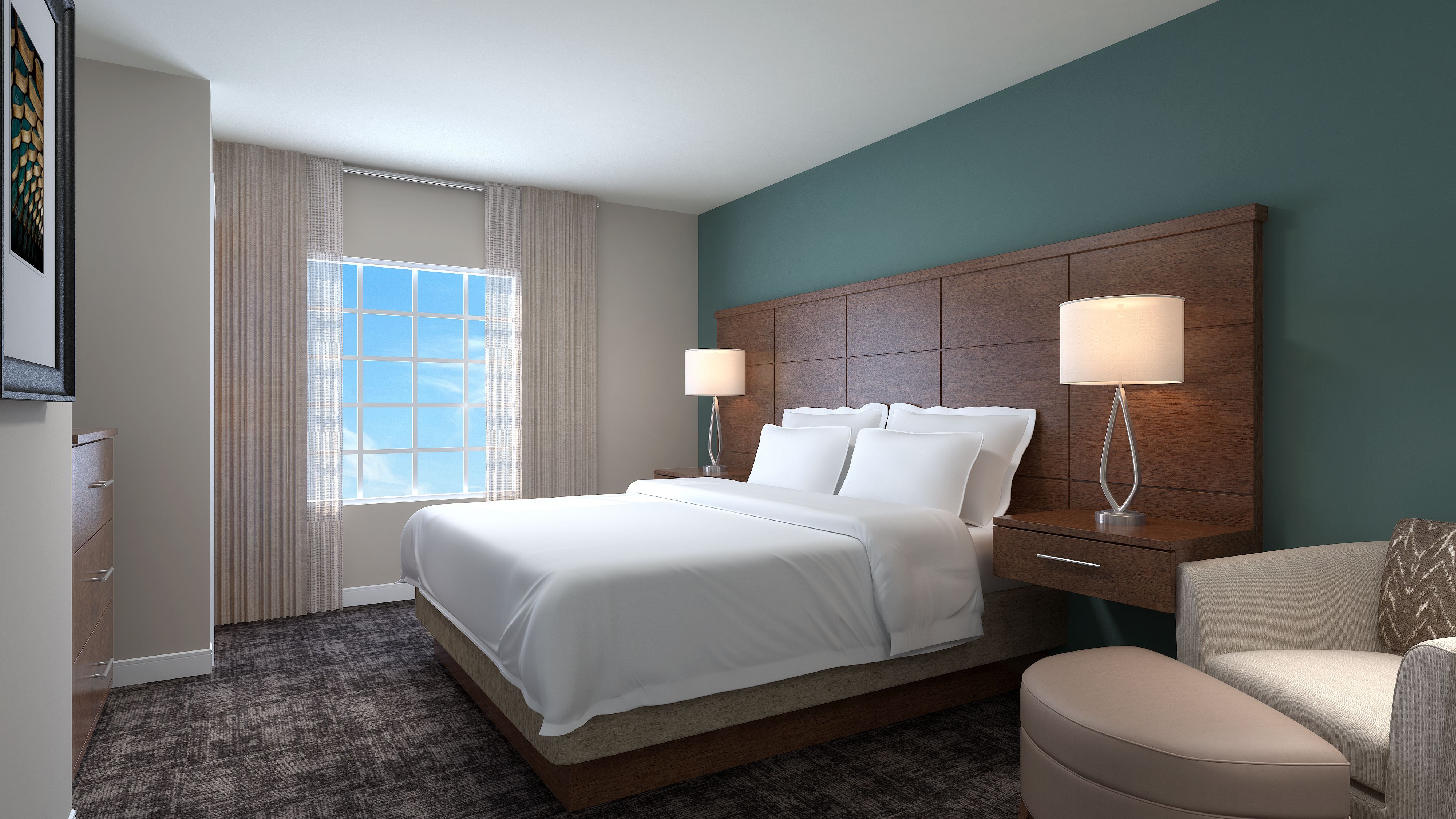 image King bedroom with comfortable bed and natural lighting.