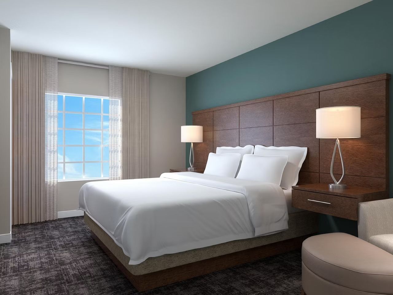 image Rest in this cozy bedroom with plush queen beds and flat-screen TV